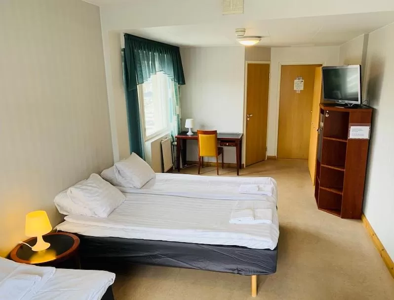 Bedroom, Bed in Hotelli Uninen Kotka