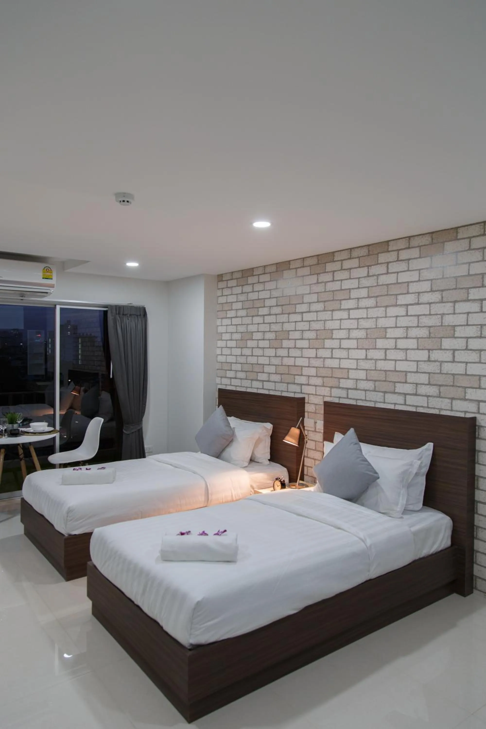 Bed in Q Space Residence