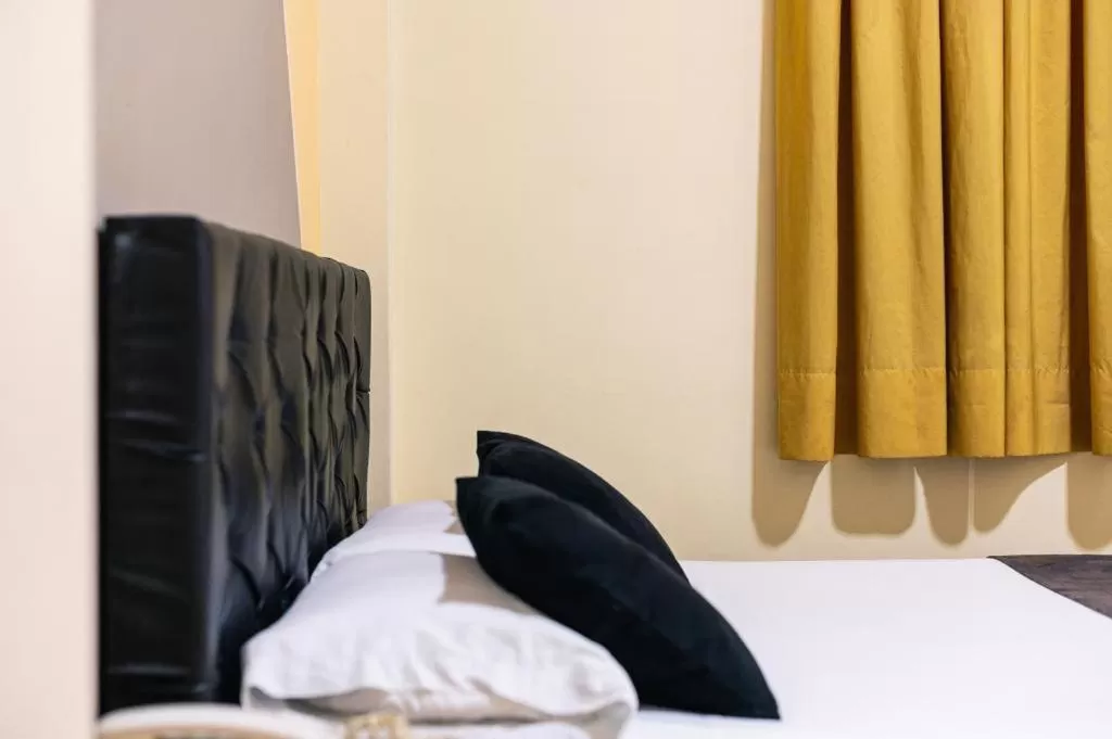 Bed in HOTEL CALLE REAL SUITE