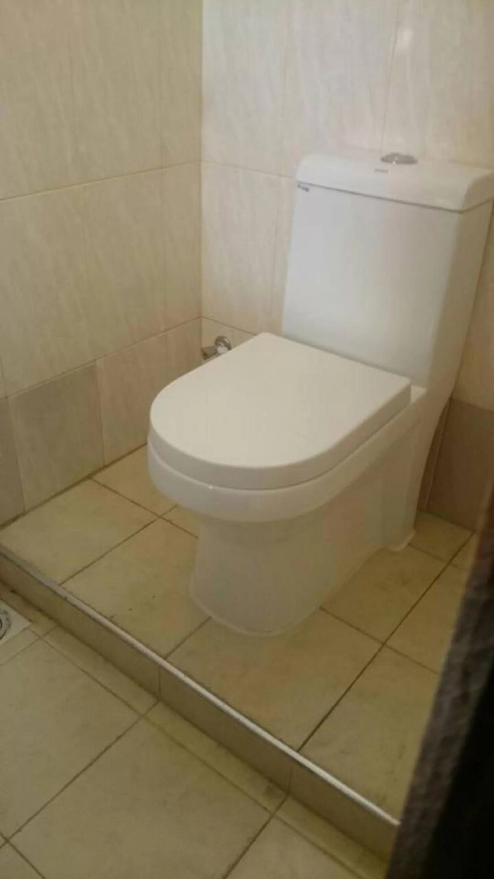 Toilet, Bathroom in Itetemia Royal Inn