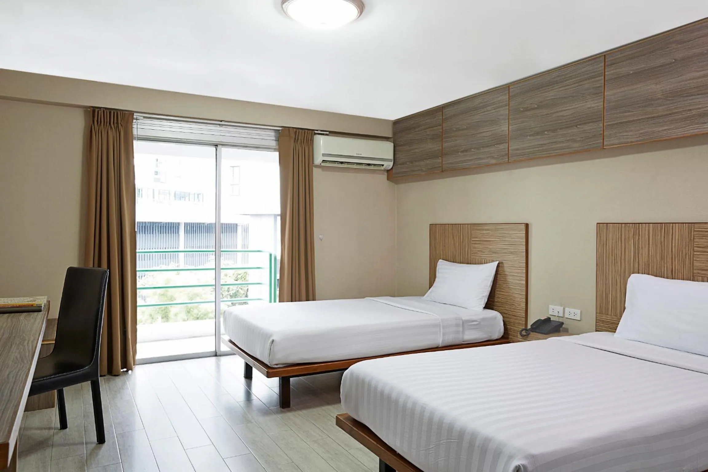 Bed in Watana Hotel