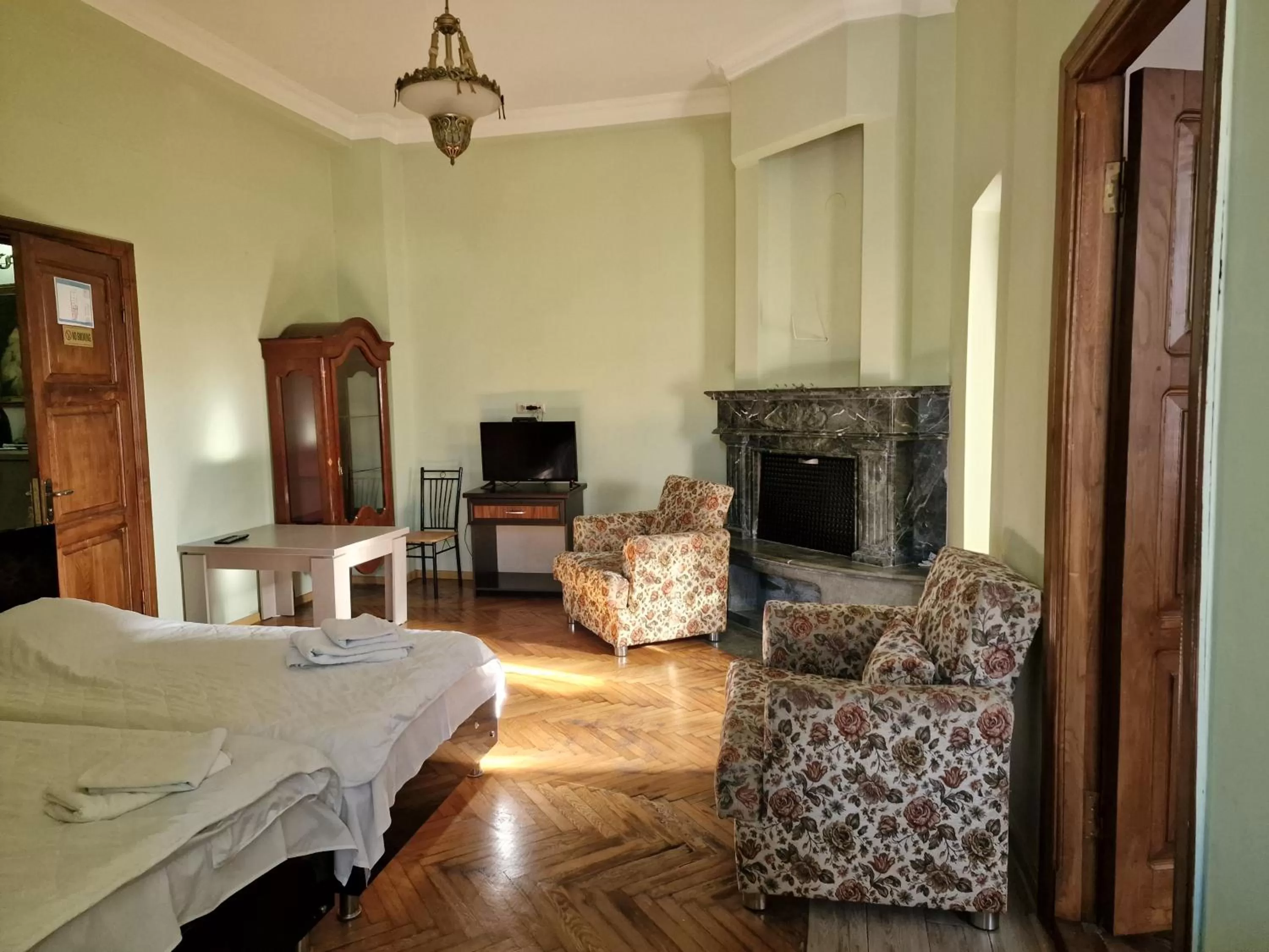 Bed, Seating Area in CATTALEYA