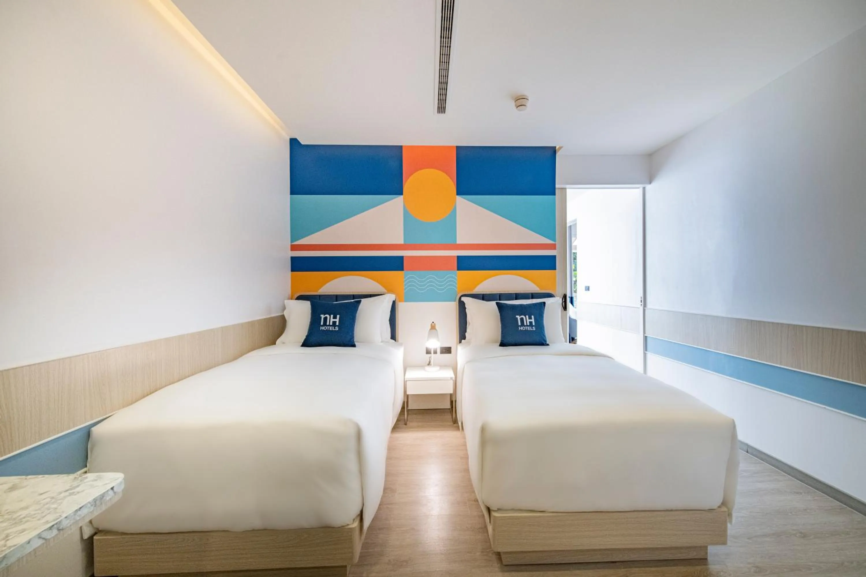 Bed in NH Boat Lagoon Phuket Resort