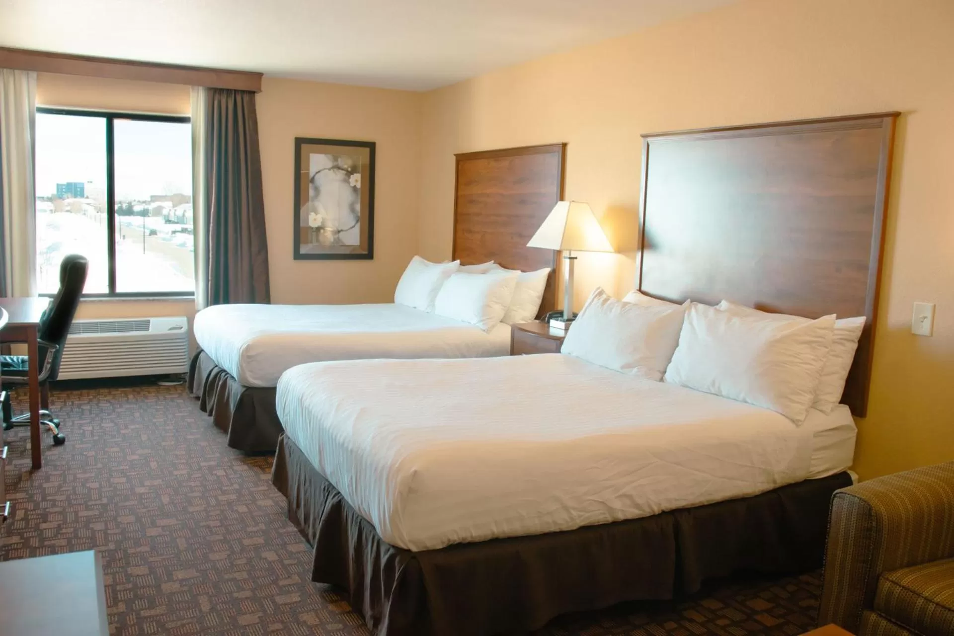 Bed in Grand Forks Lodge and Suites
