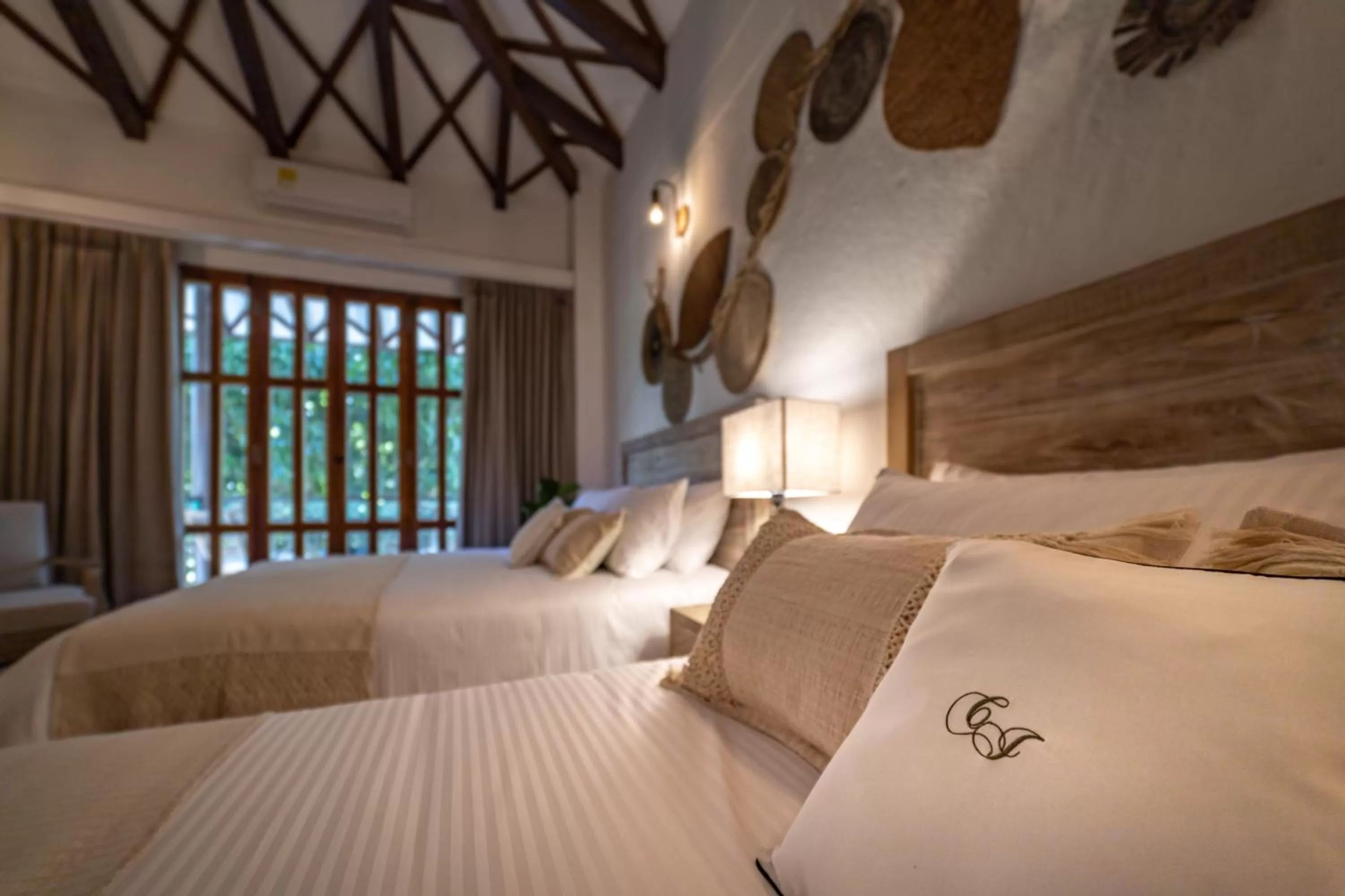 Bed in Casa Jacaranda Hotel Boutique