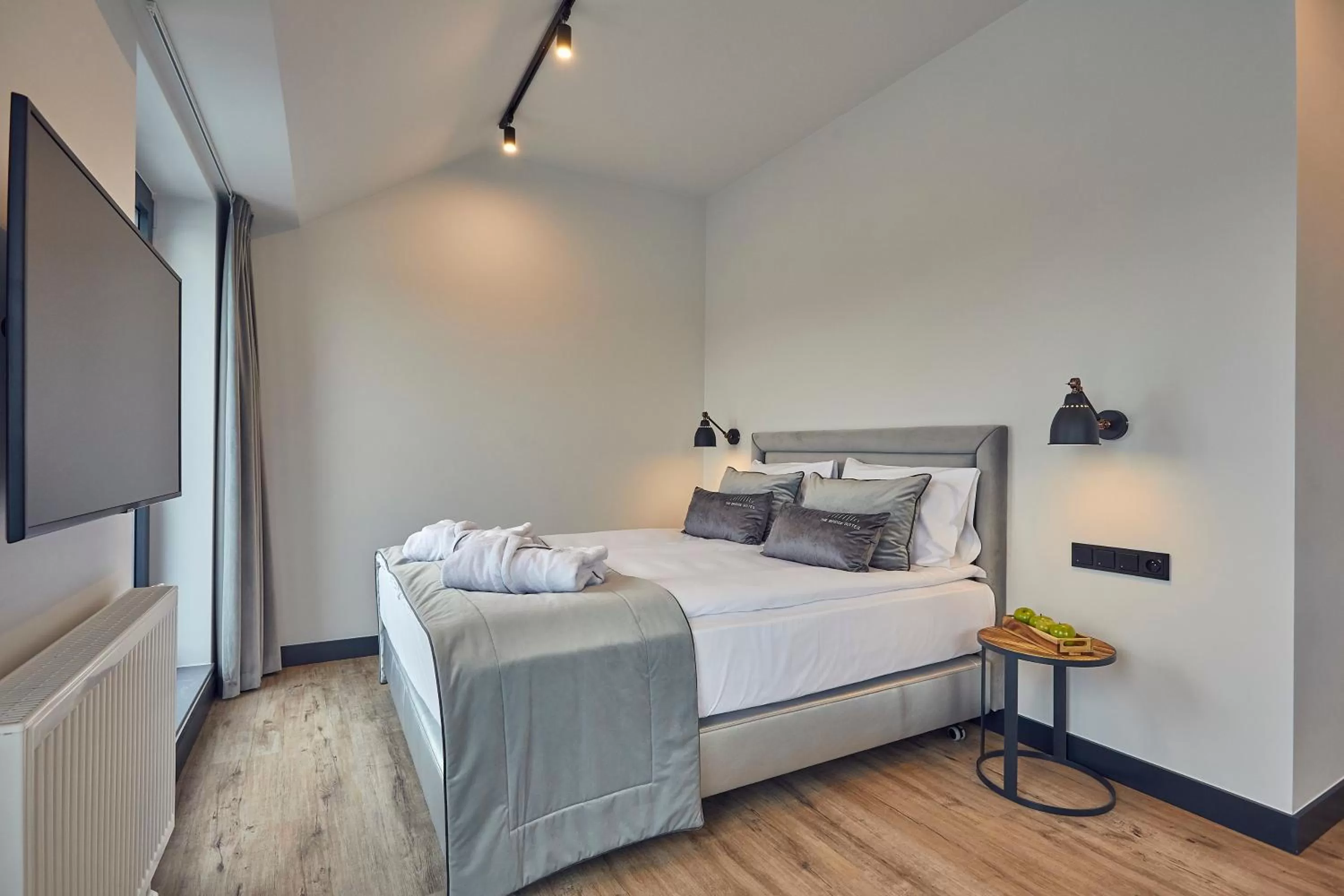 Bed in The Bridge Suites Hotel