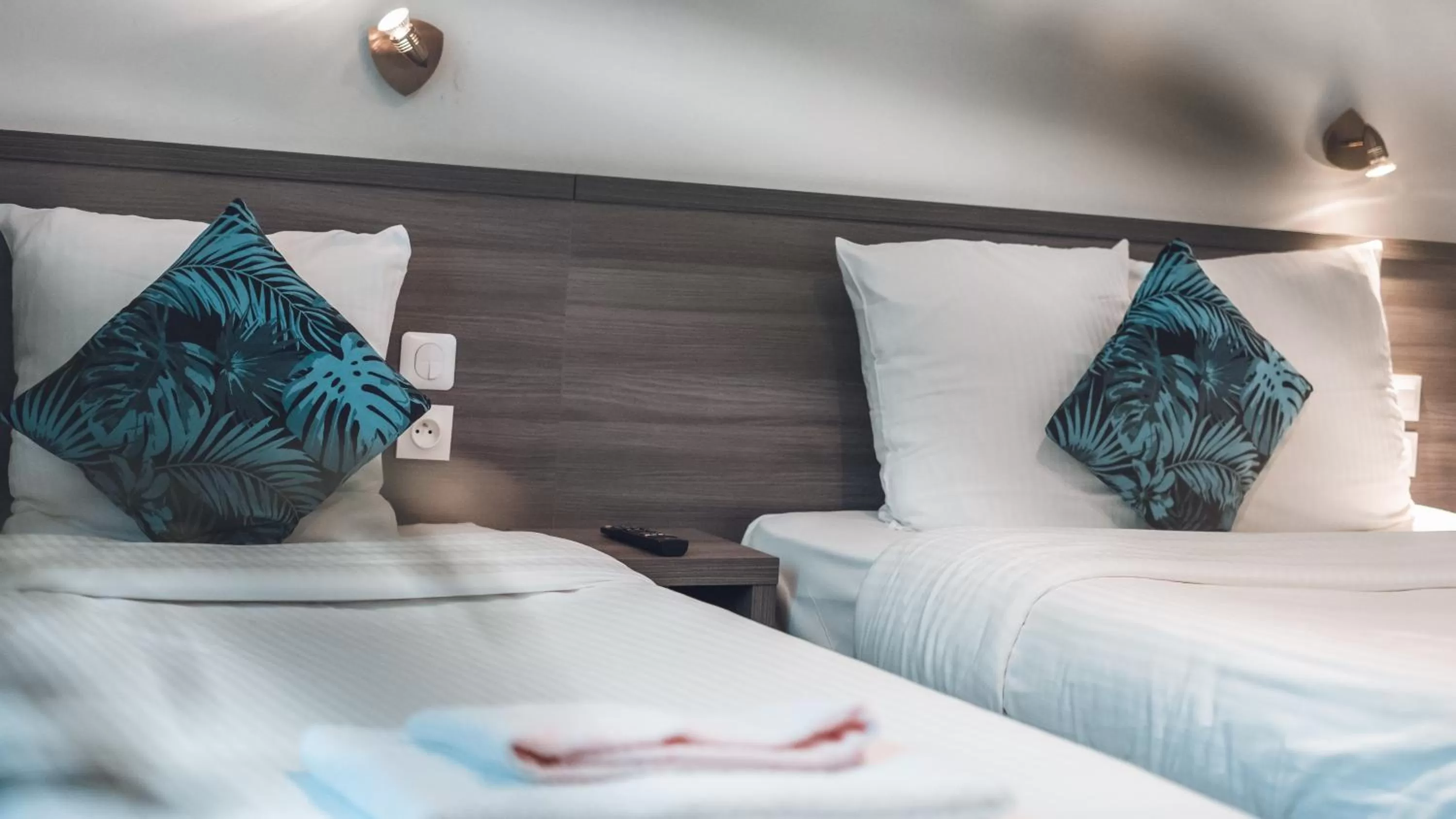 Bed in Logis Hôtel Vuillot