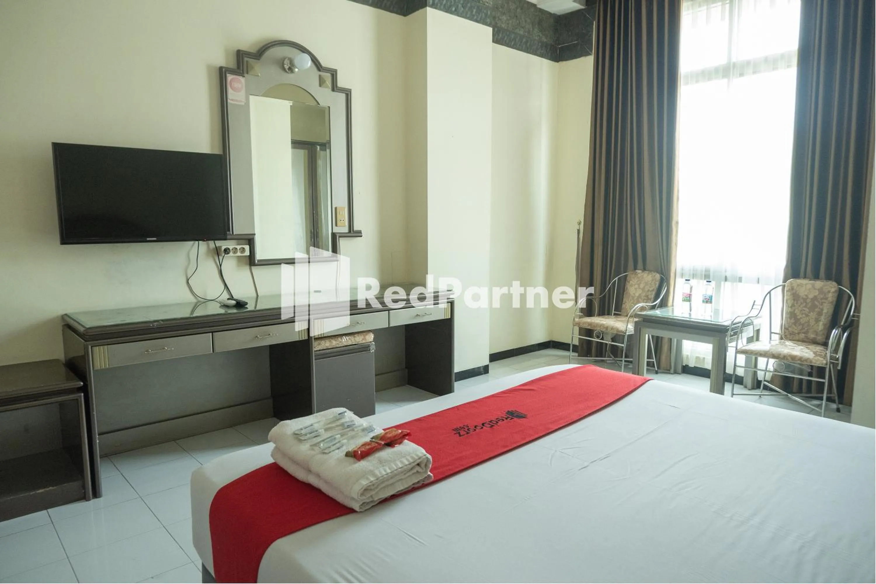 Bed in Akur Hotel Malioboro Mitra RedDoorz