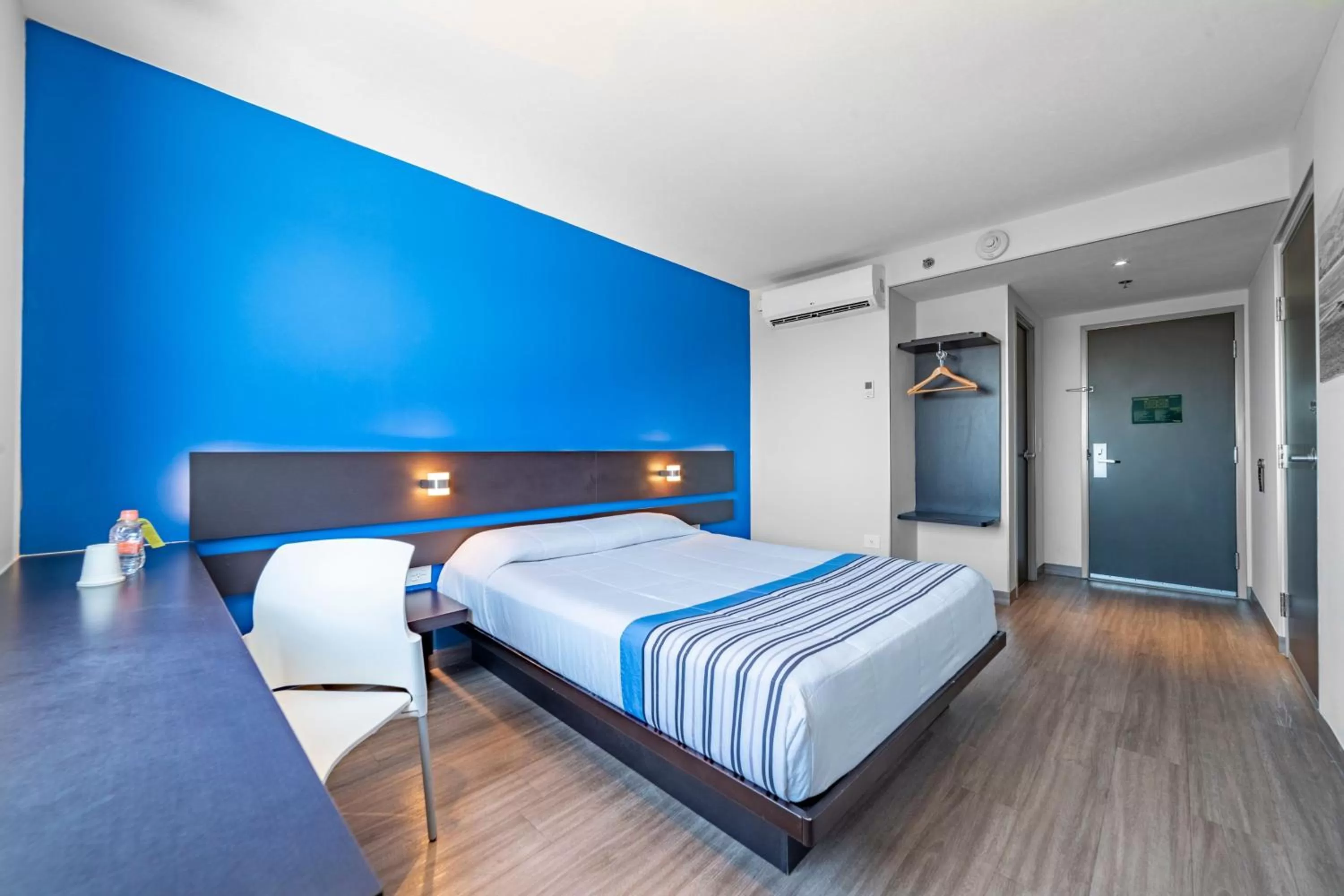 Bedroom, Bed in City Express Junior by Marriott Merida Altabrisa