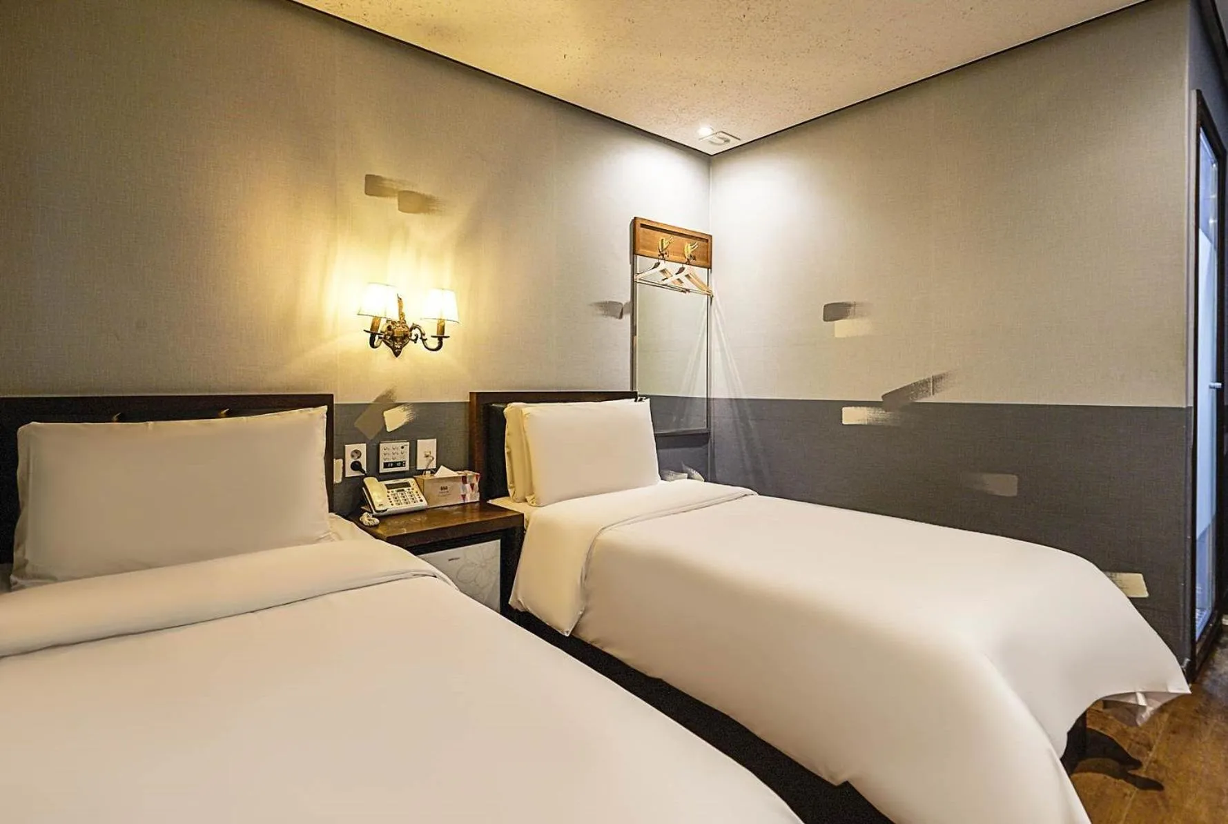 Bed in Friendly DH Naissance Hotel by Mindrum Group