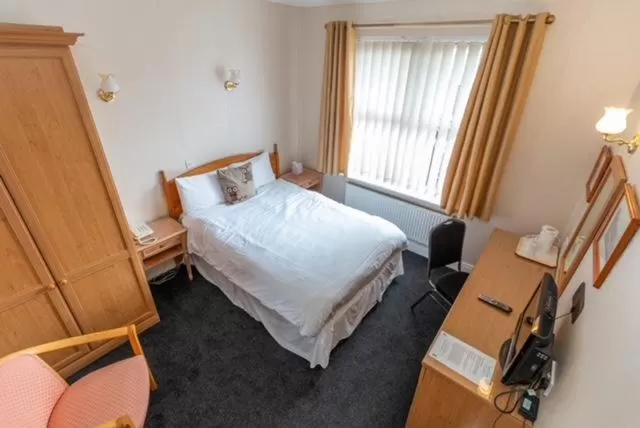 Bed in The Quorn Lodge Hotel