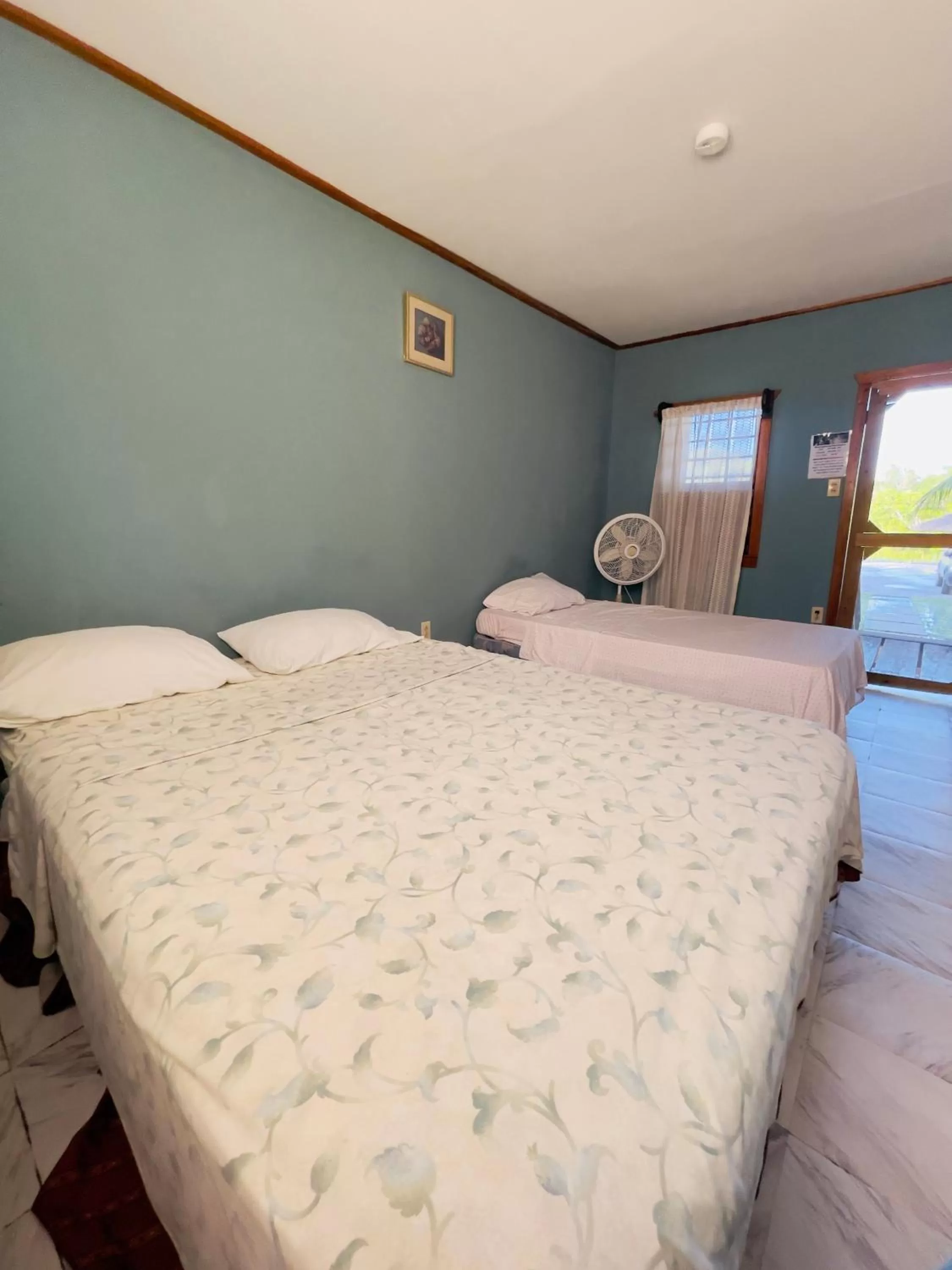 Bed in Lamanai Riverside Retreat