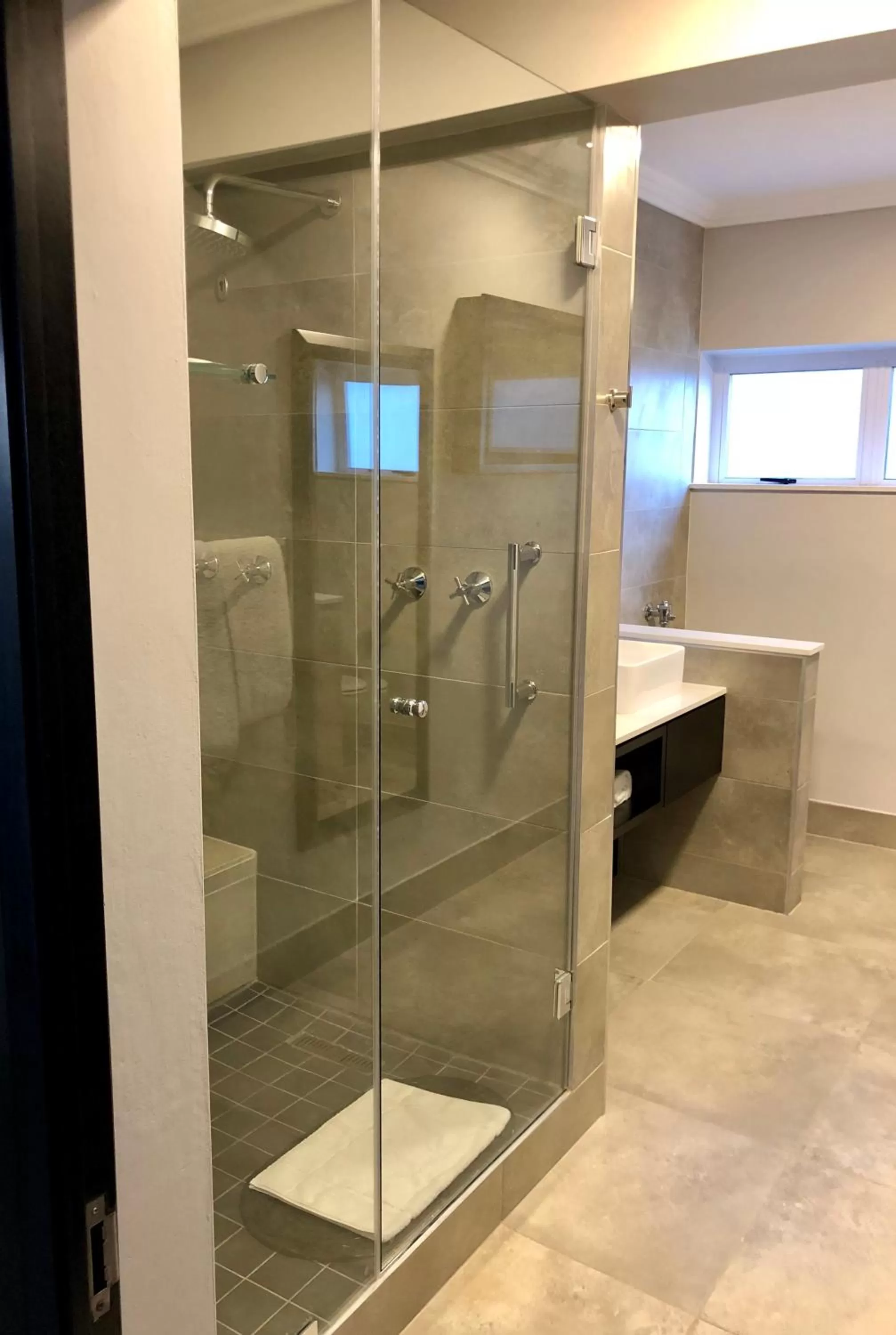 Shower in Belaire Suites Hotel