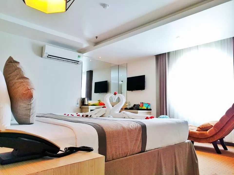 Bed in Holiday One Can Tho Hotel