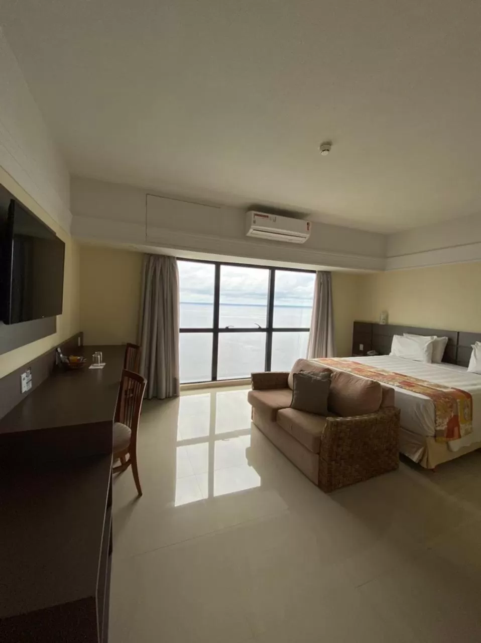 Bed in Tropical Executive Hotel