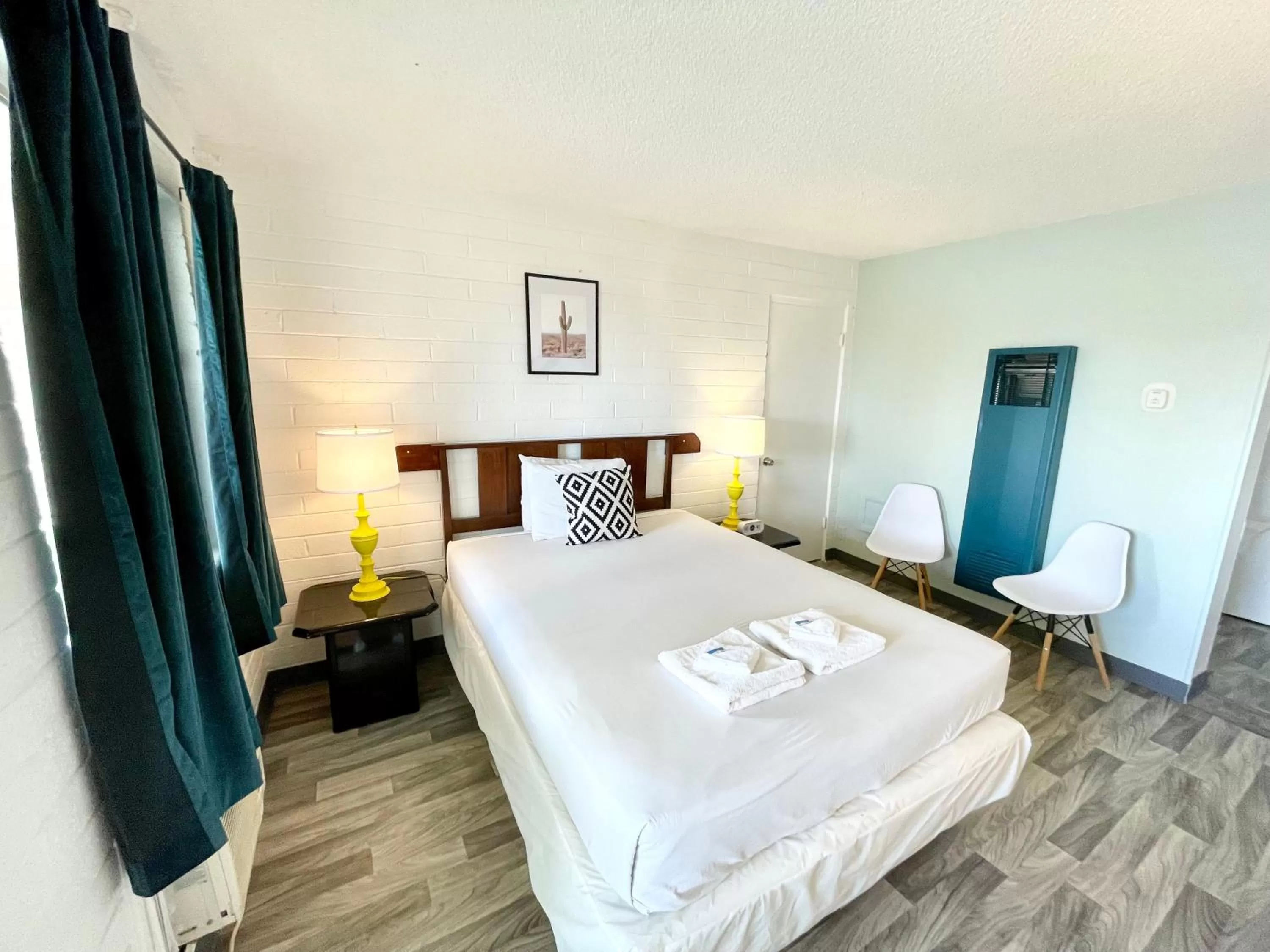 Bed in The Postcard Motel