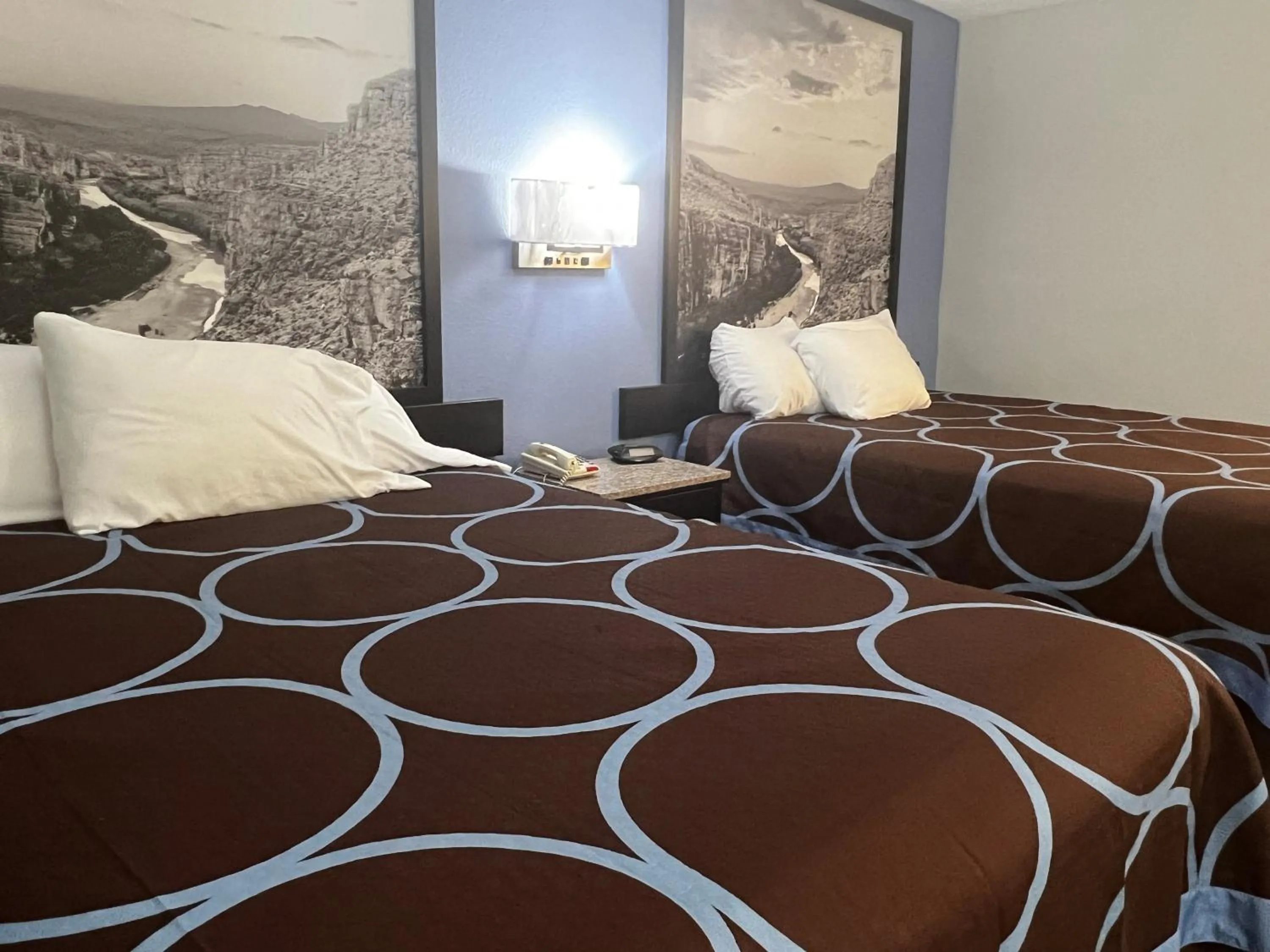 Bed in Super 8 by Wyndham Cleveland TX