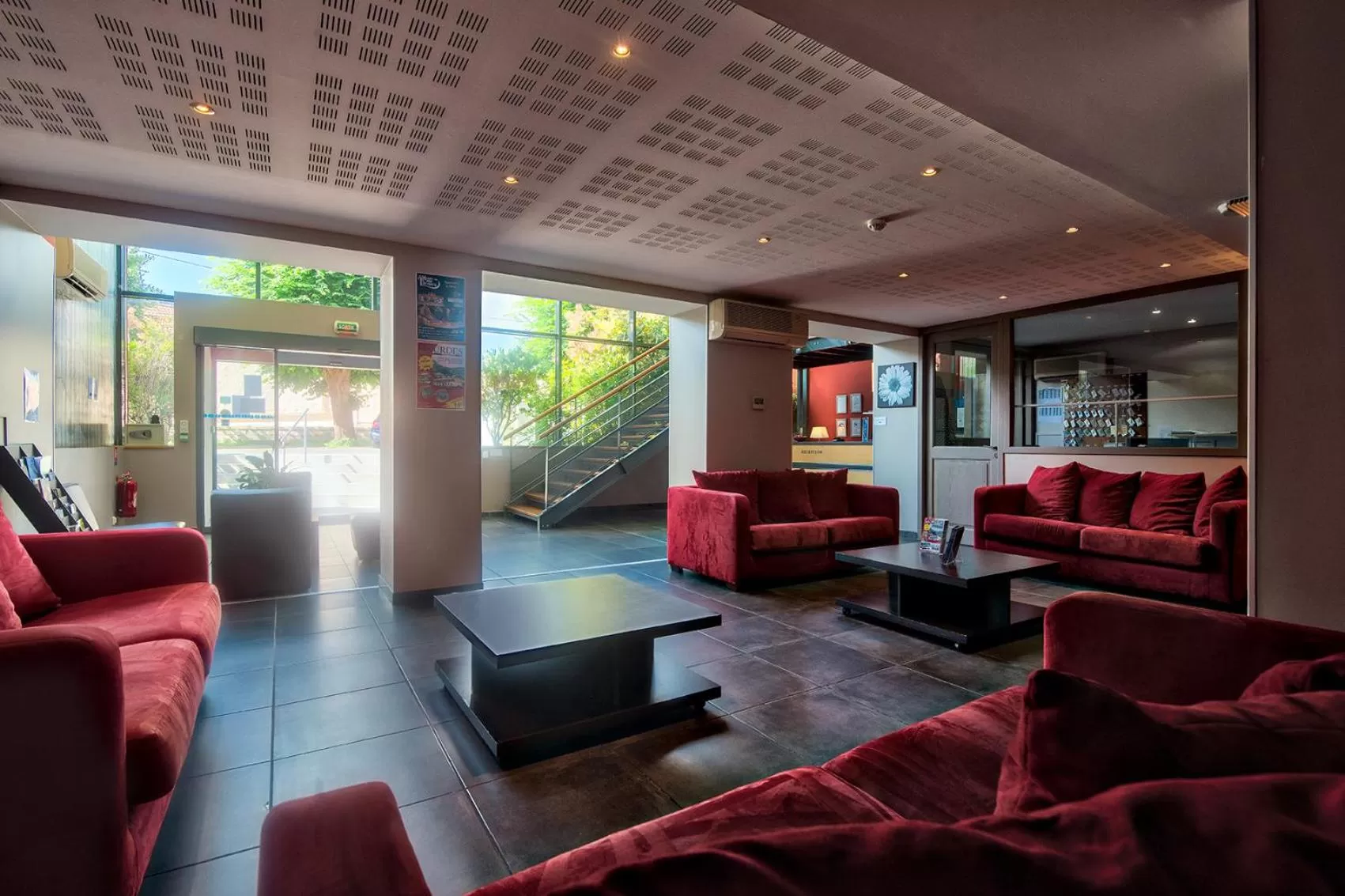 Communal lounge/ TV room in Zenitude Hôtel-Résidences Les Jardins de Lourdes