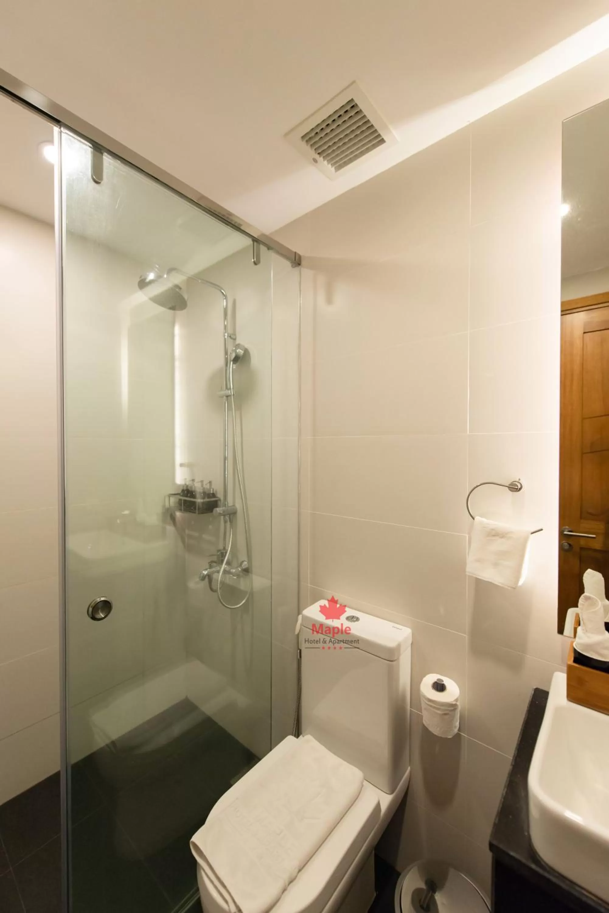 Shower in Maple Hotel & Apartment