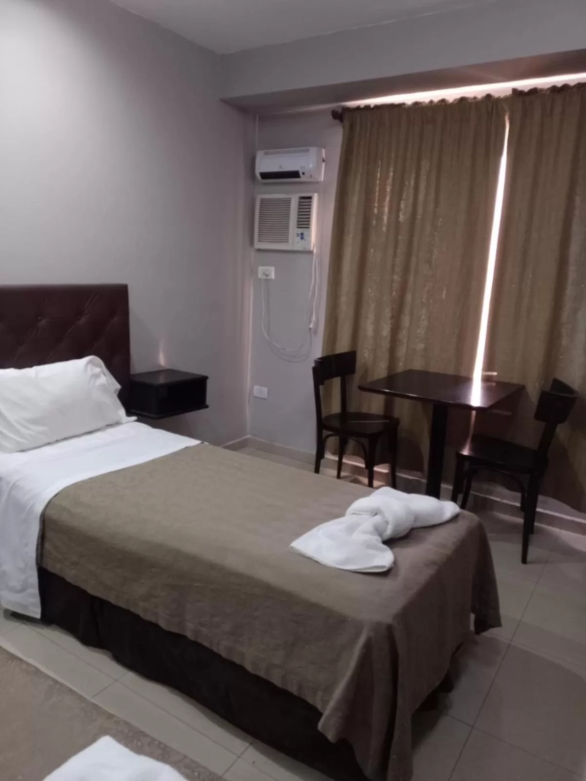 Bed in Lorenzo Suites Hotel