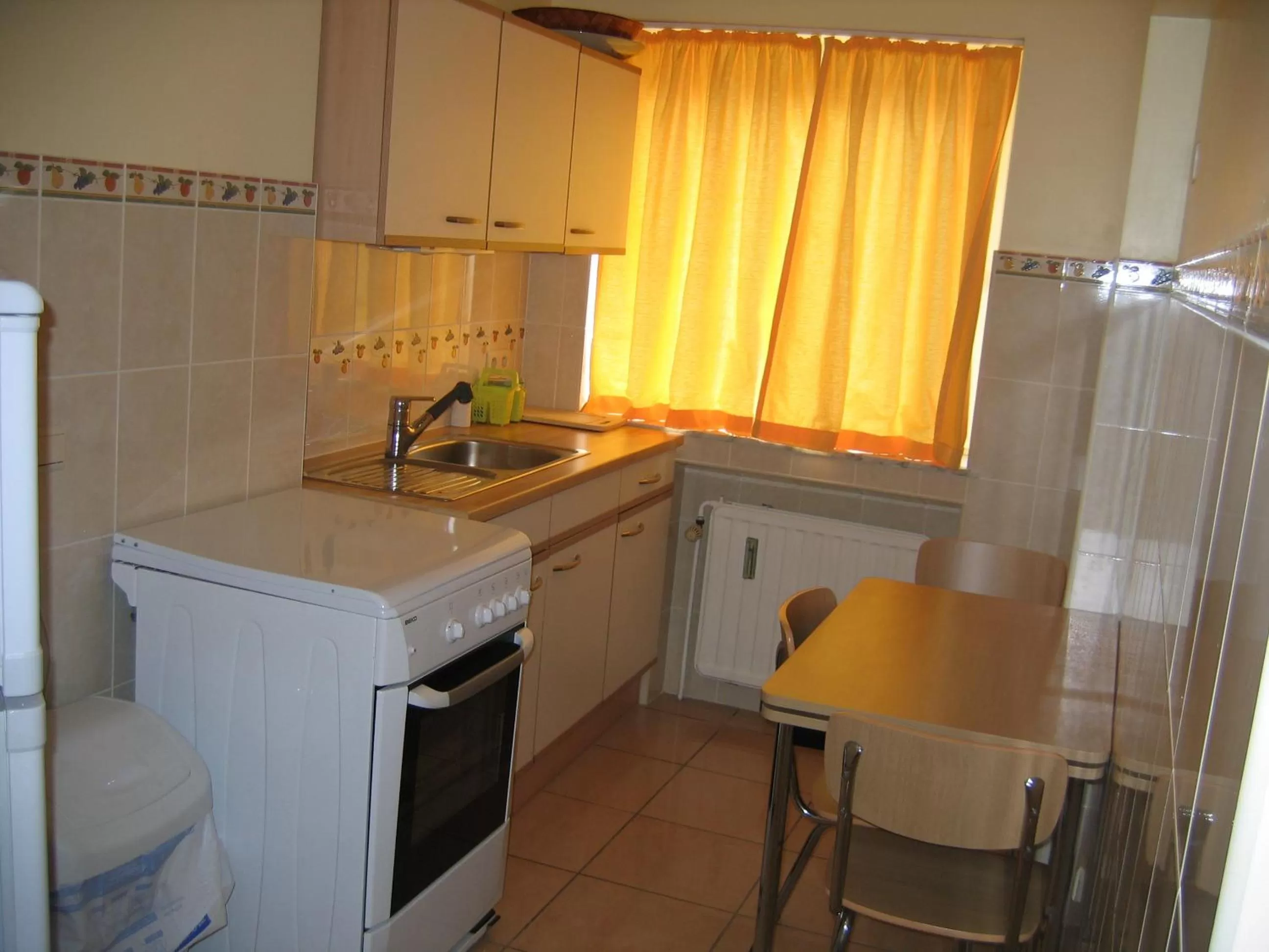 Kitchen or kitchenette in Aparthotel Résidence Bara Midi