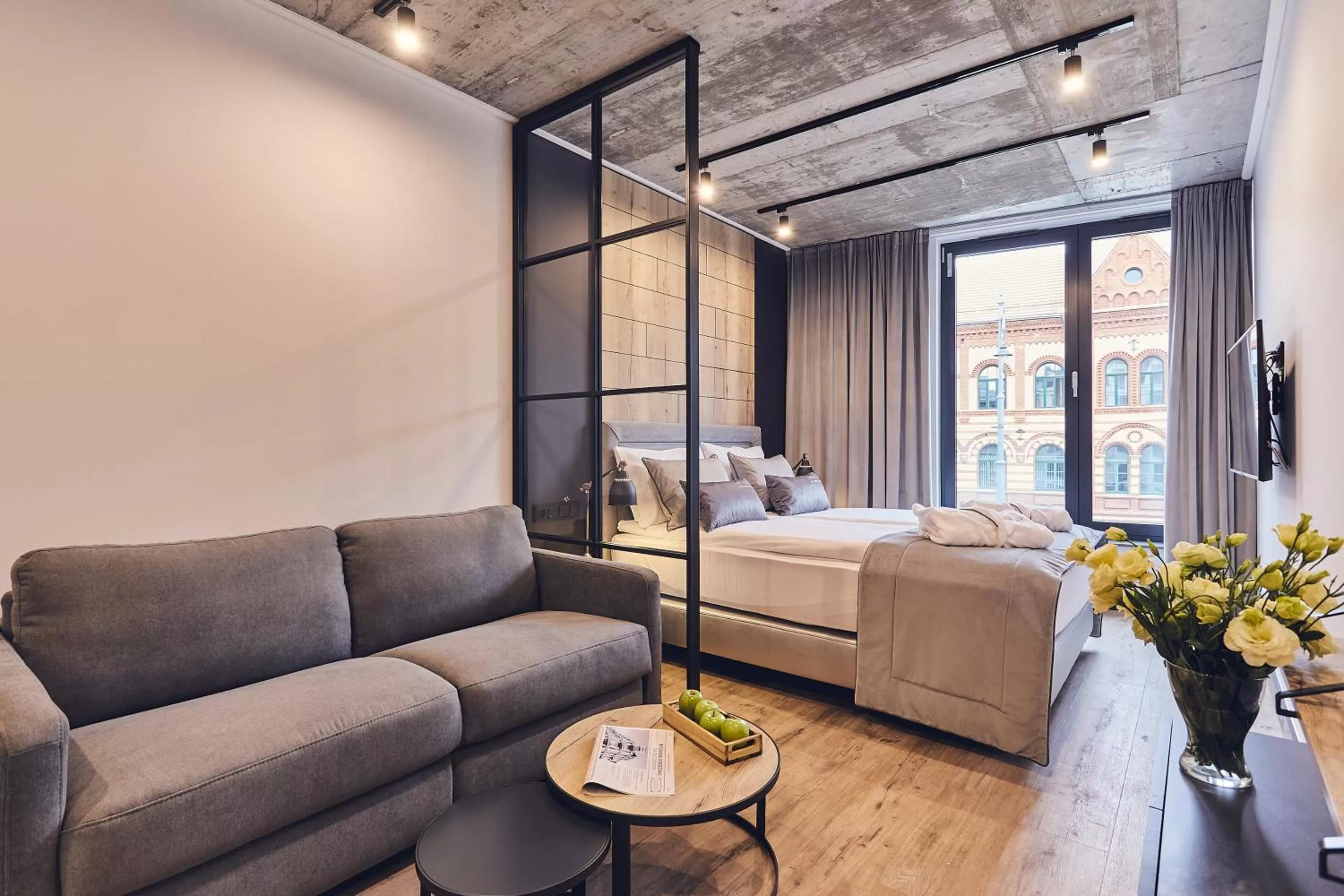 Living room, Bed in The Bridge Suites Hotel