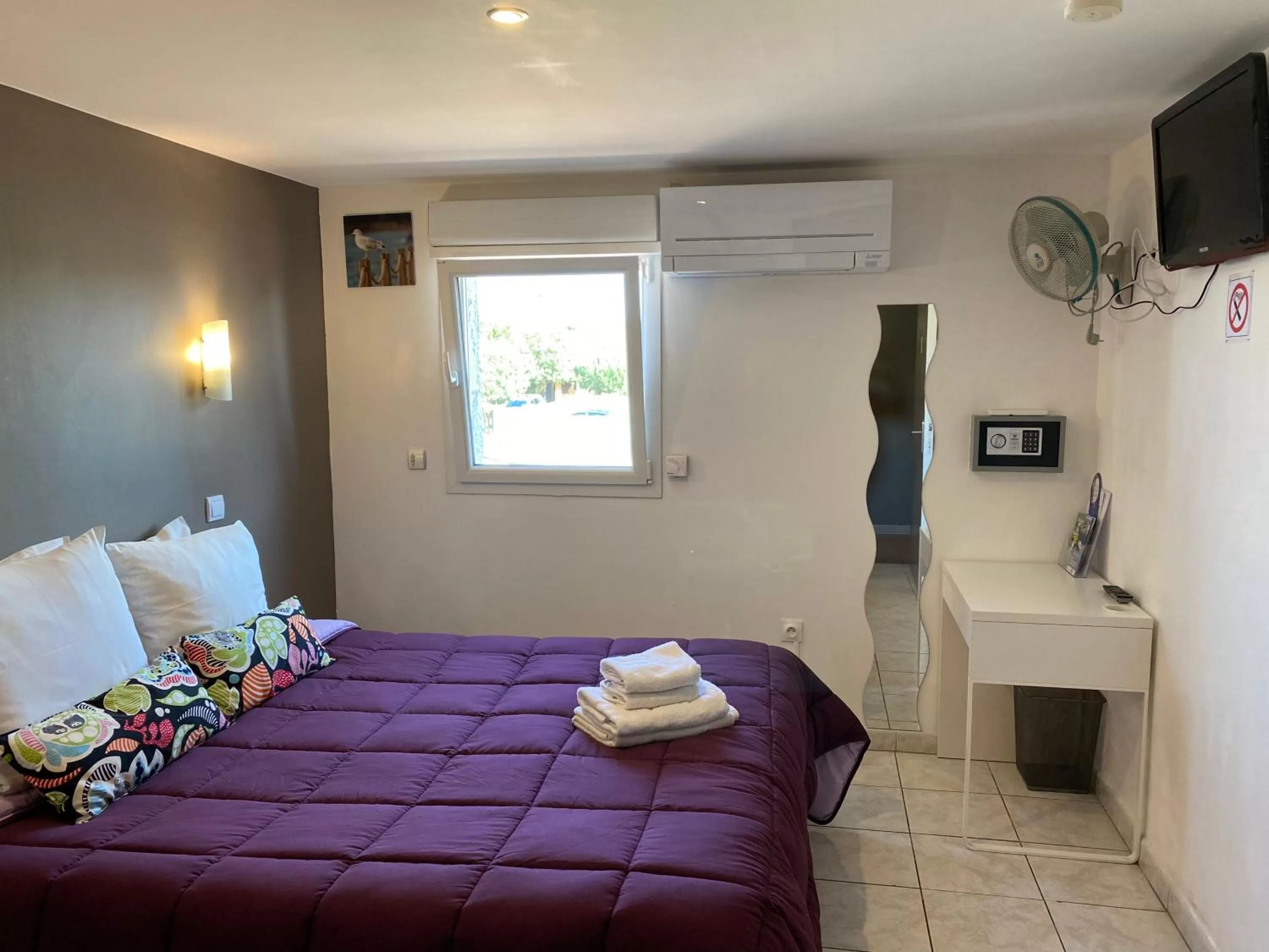 Bed in LOGIS Hôtel La Chaumière