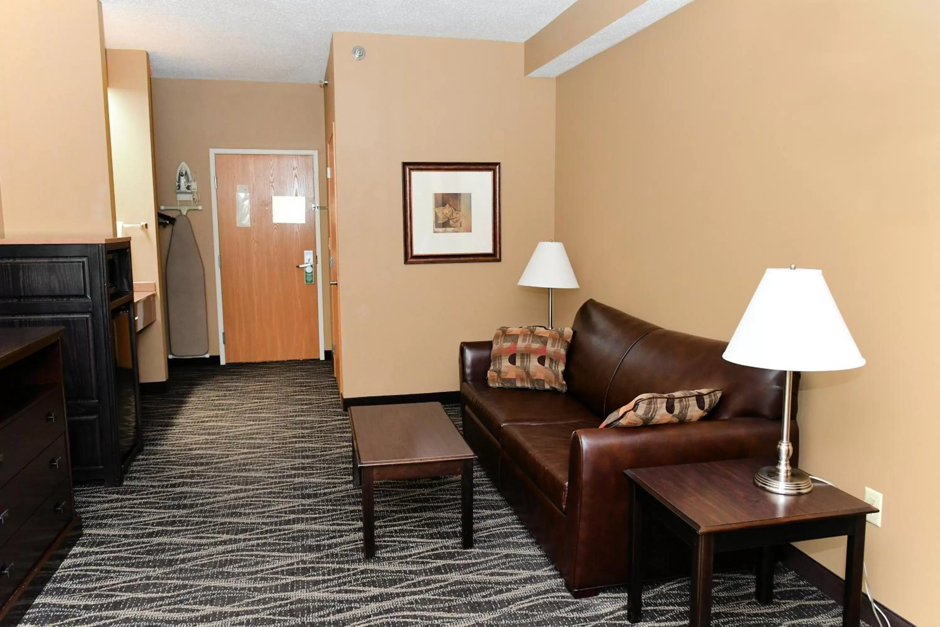 Living room in Cobblestone Inn & Suites - Denison | Majestic Hills