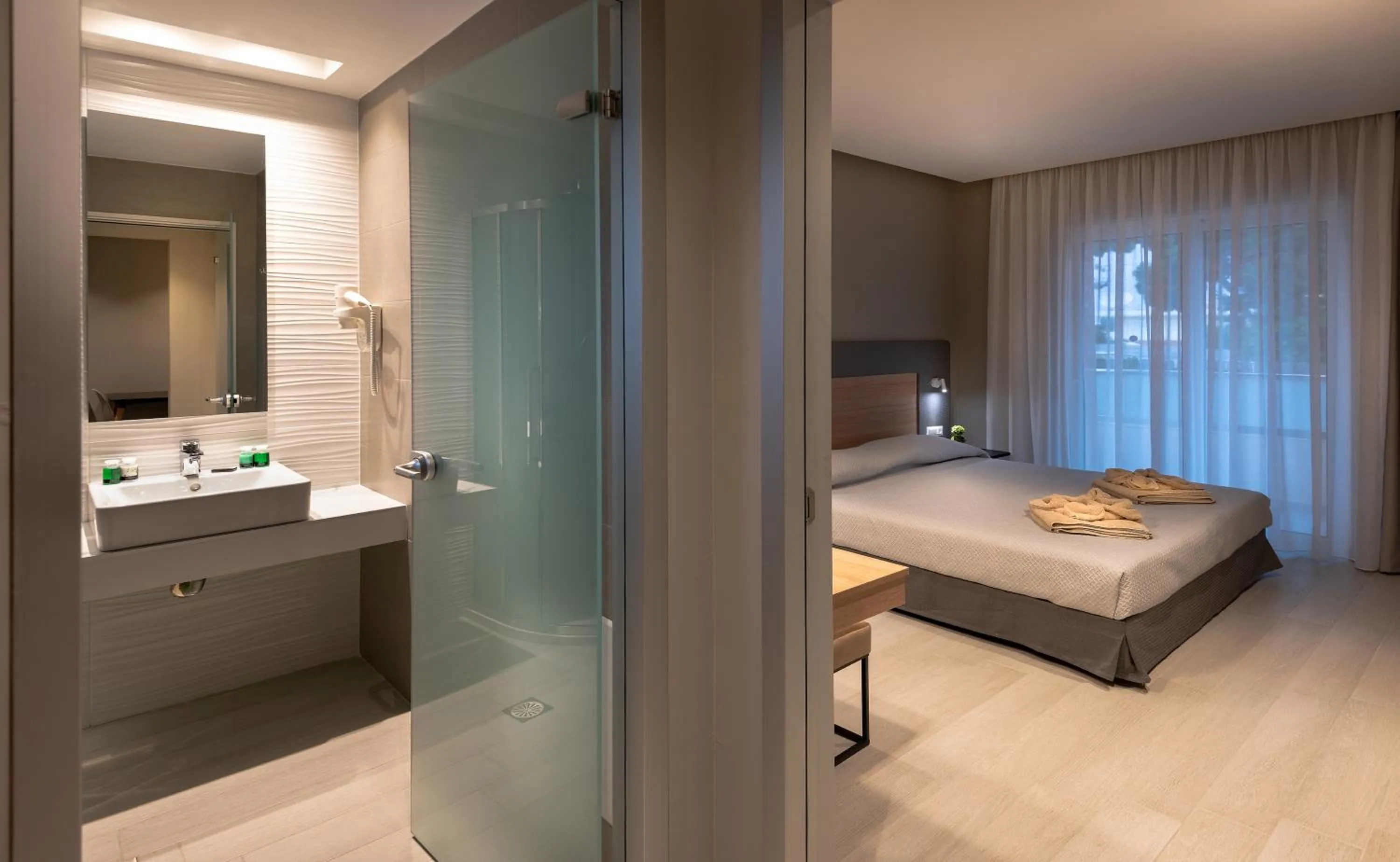 Bathroom, Bed in Sunday Hotel