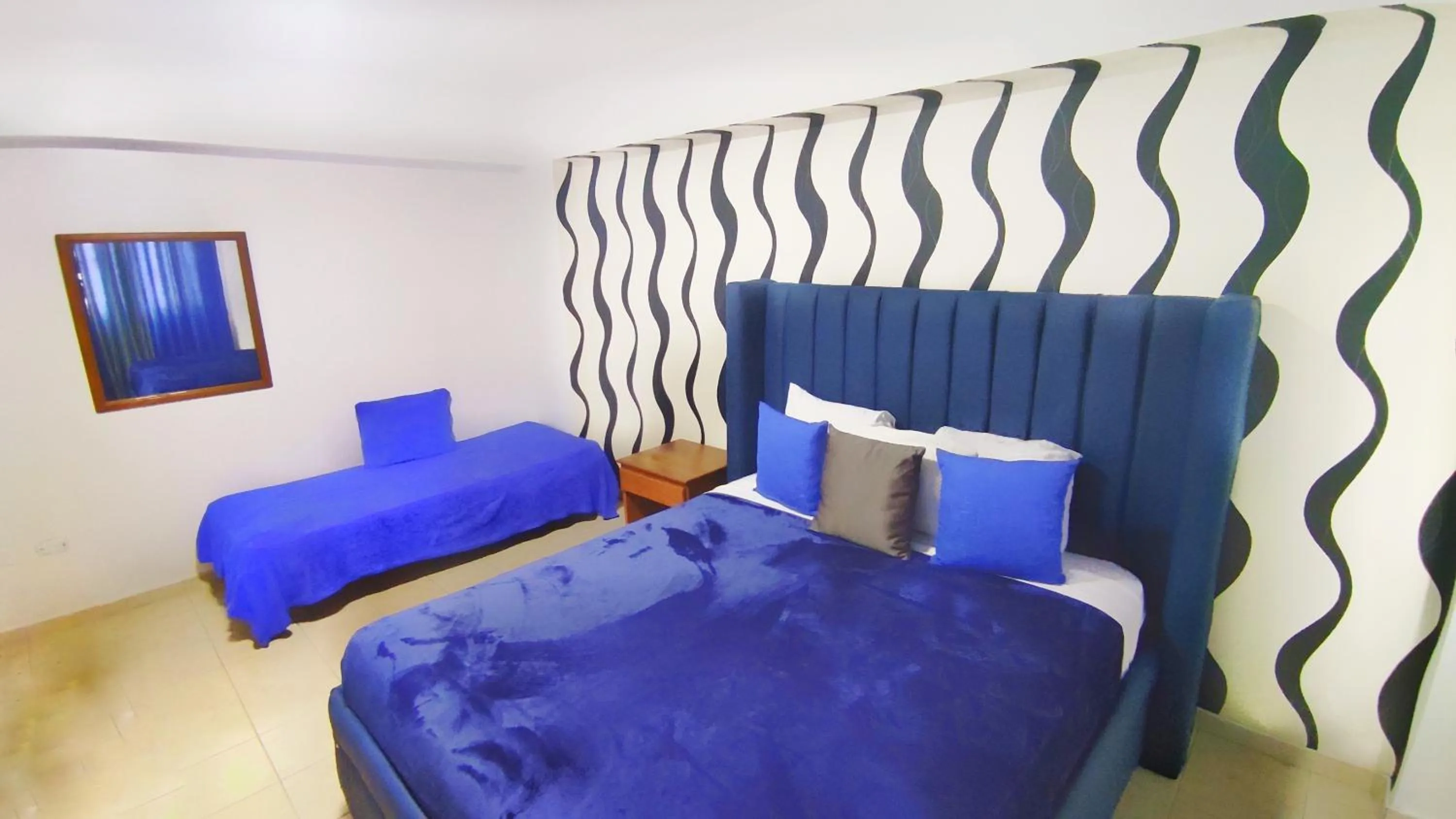 Bed in Acuarium Suite Resort