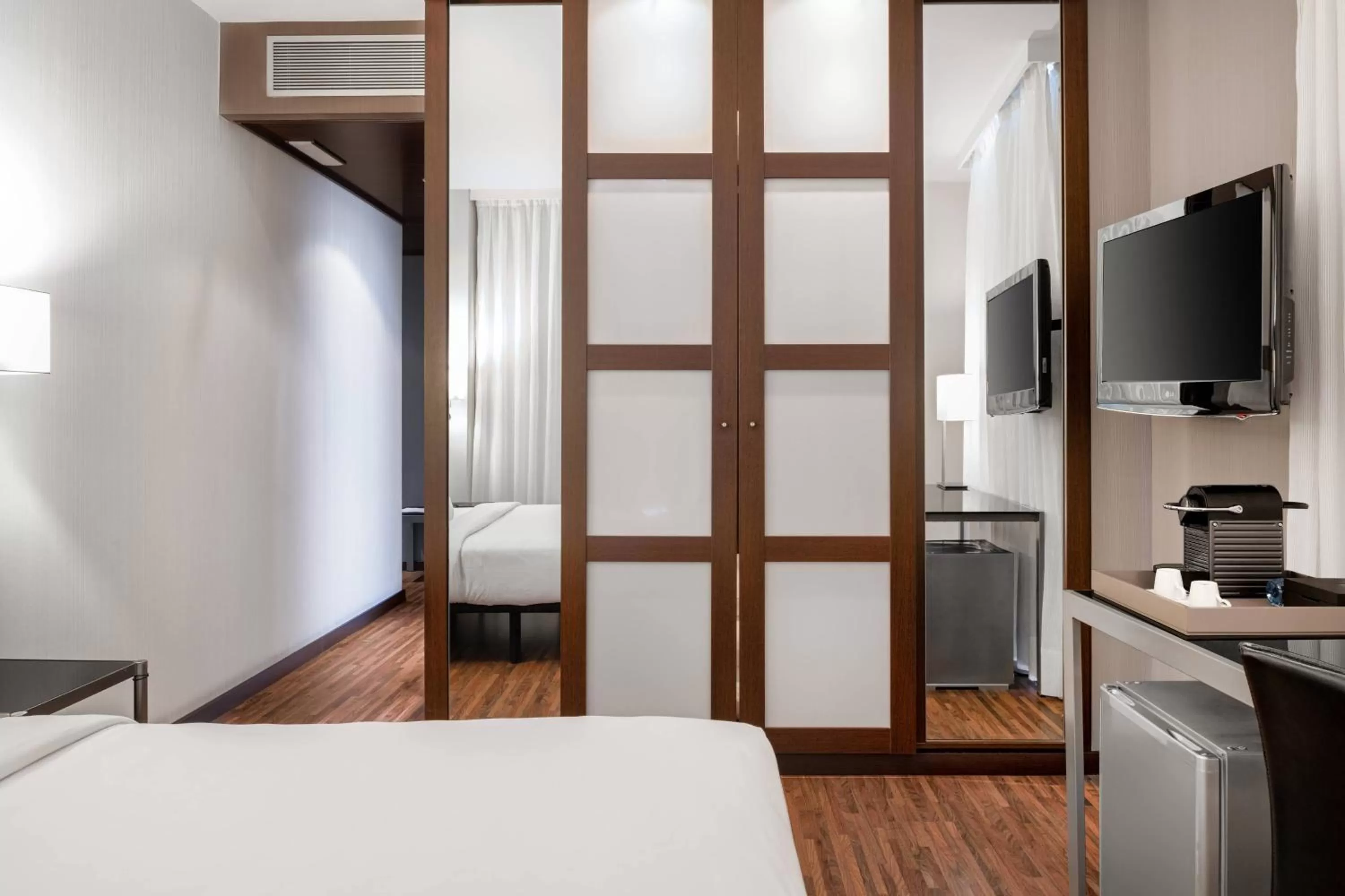 Photo of the whole room, Bed in AC Hotel Palacio Universal by Marriott