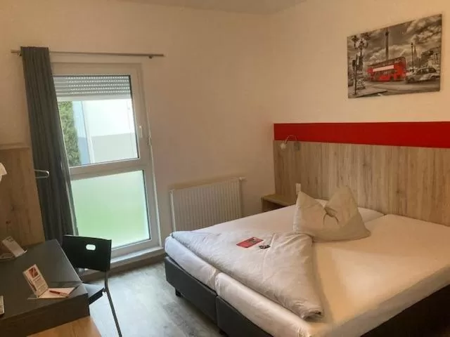 Photo of the whole room, Bed in Hotel Hohenloher Tor