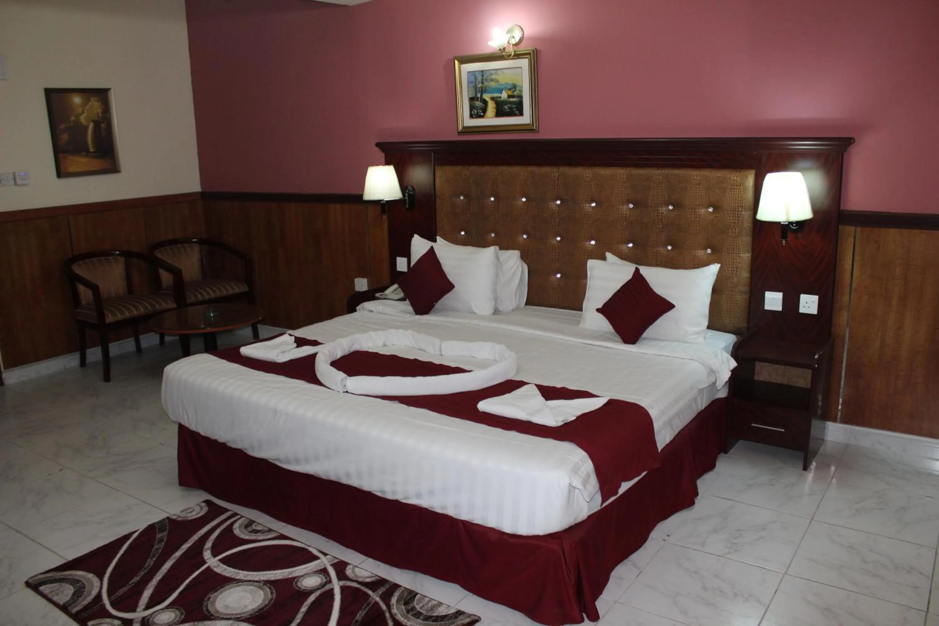 Bed in Grand Nova Hotel