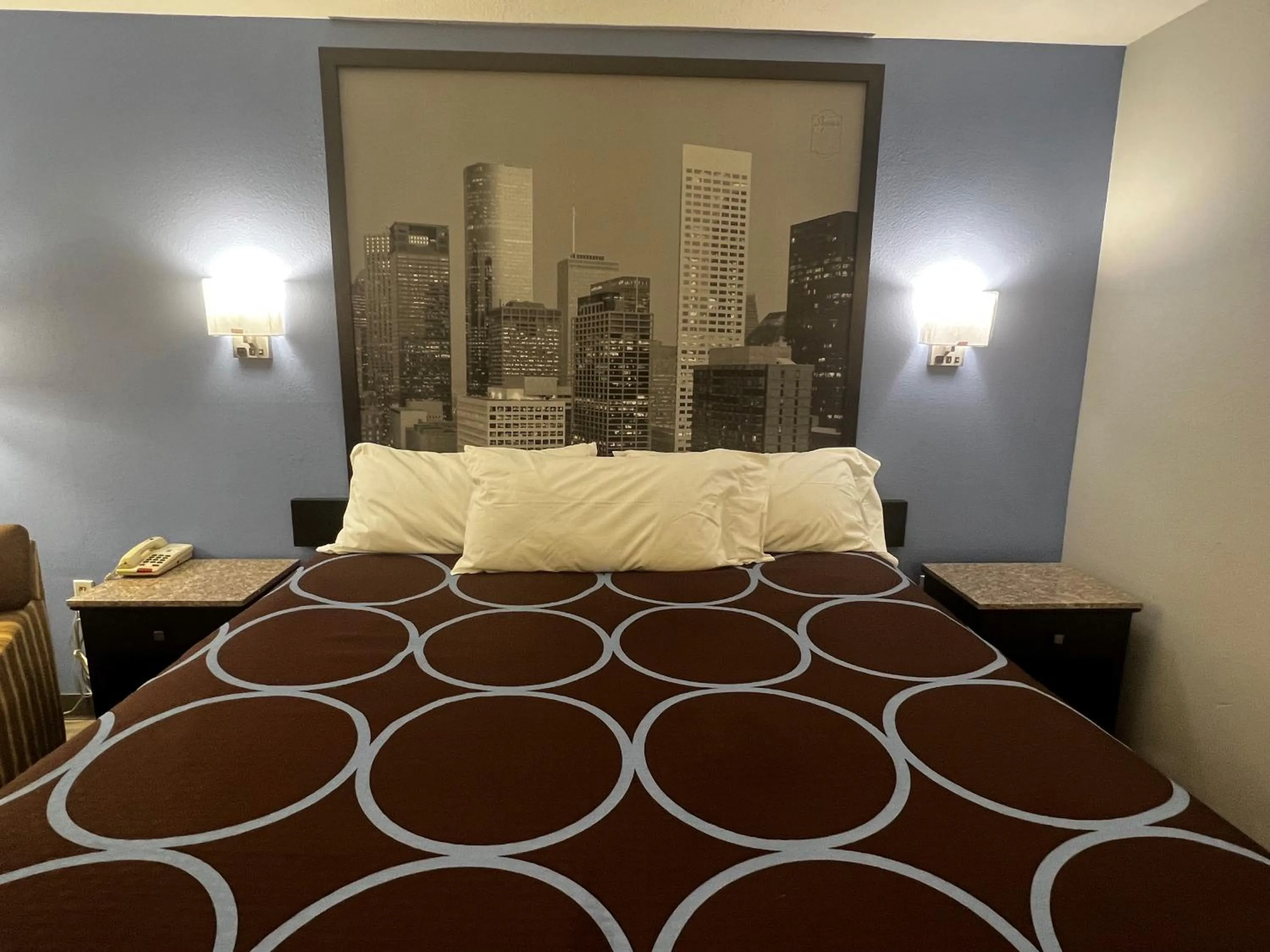 Bed in Super 8 by Wyndham Cleveland TX