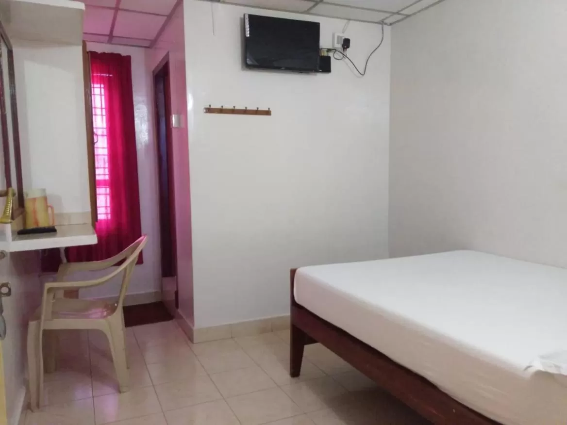 Bed in Anandan Tourist Home