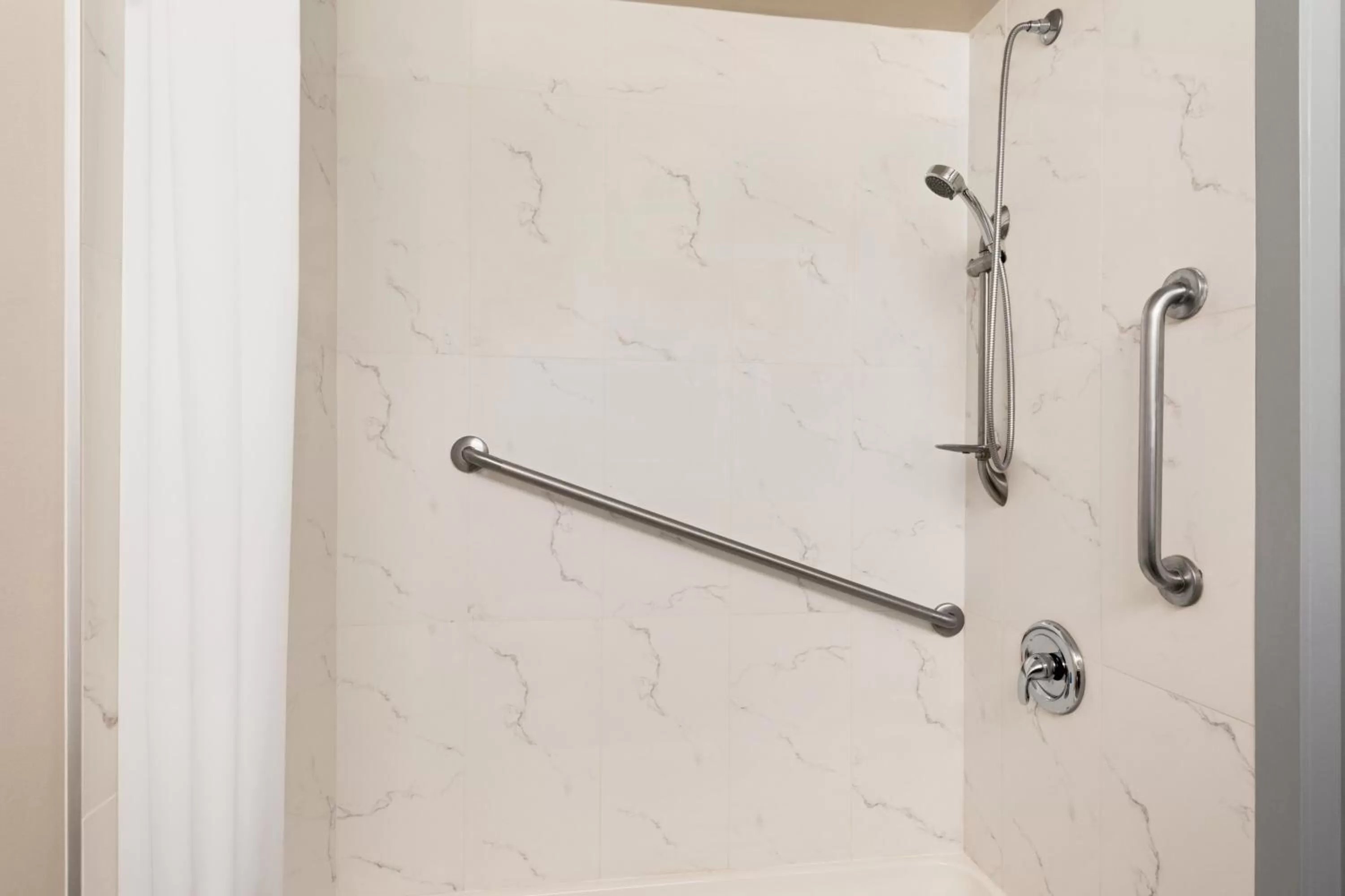 Shower in Travelodge by Wyndham Calgary South