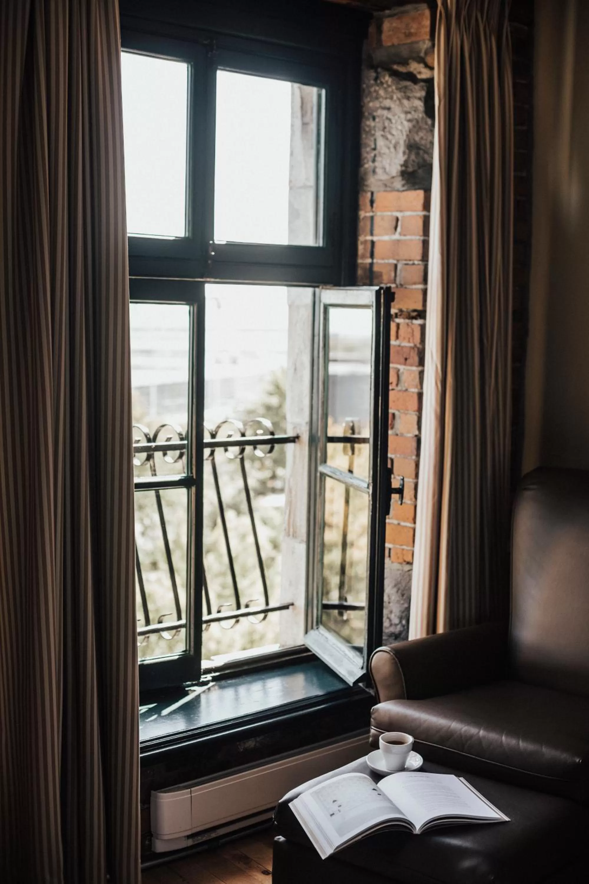 Seating area in Auberge du Vieux Port by Gray Collection