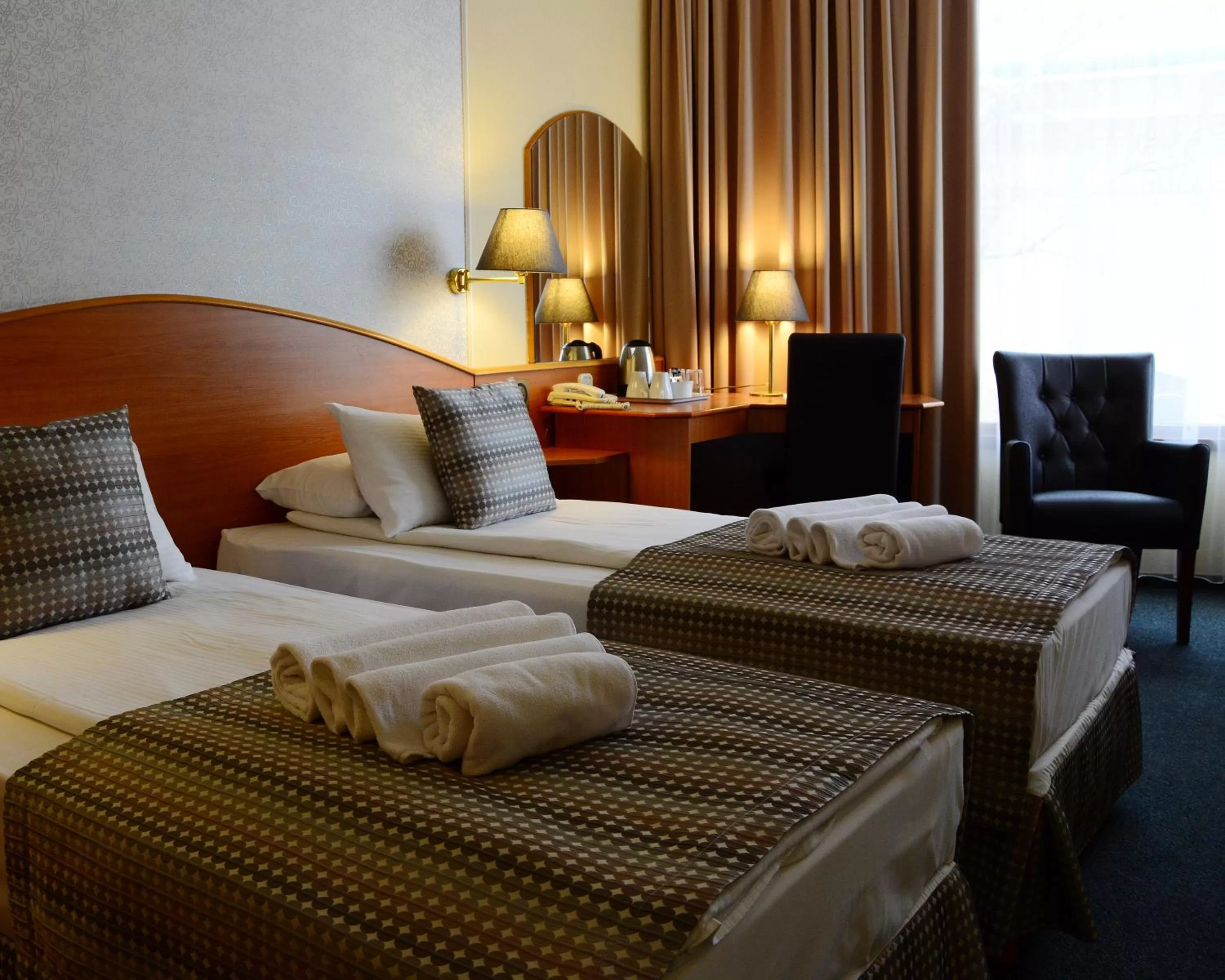 Living room, Bed in Hotel Orion