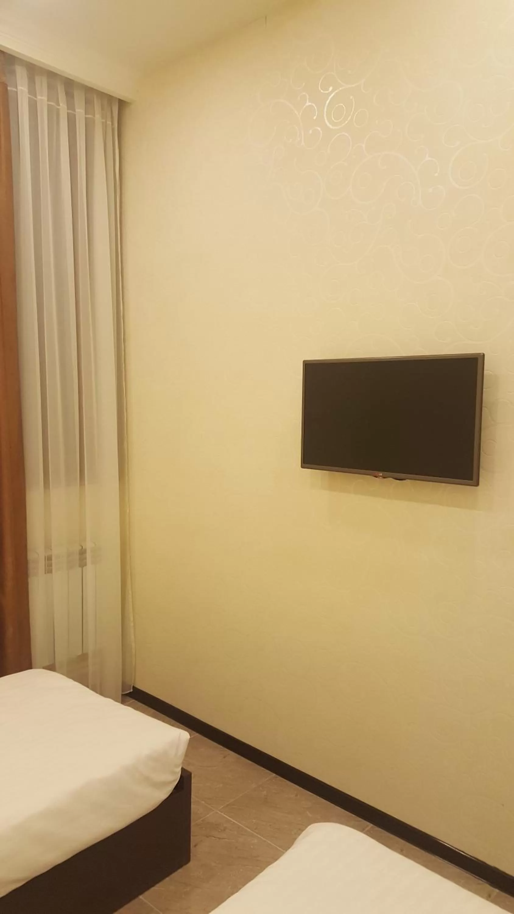 Bedroom, TV/Entertainment Center in Eridana Hotel