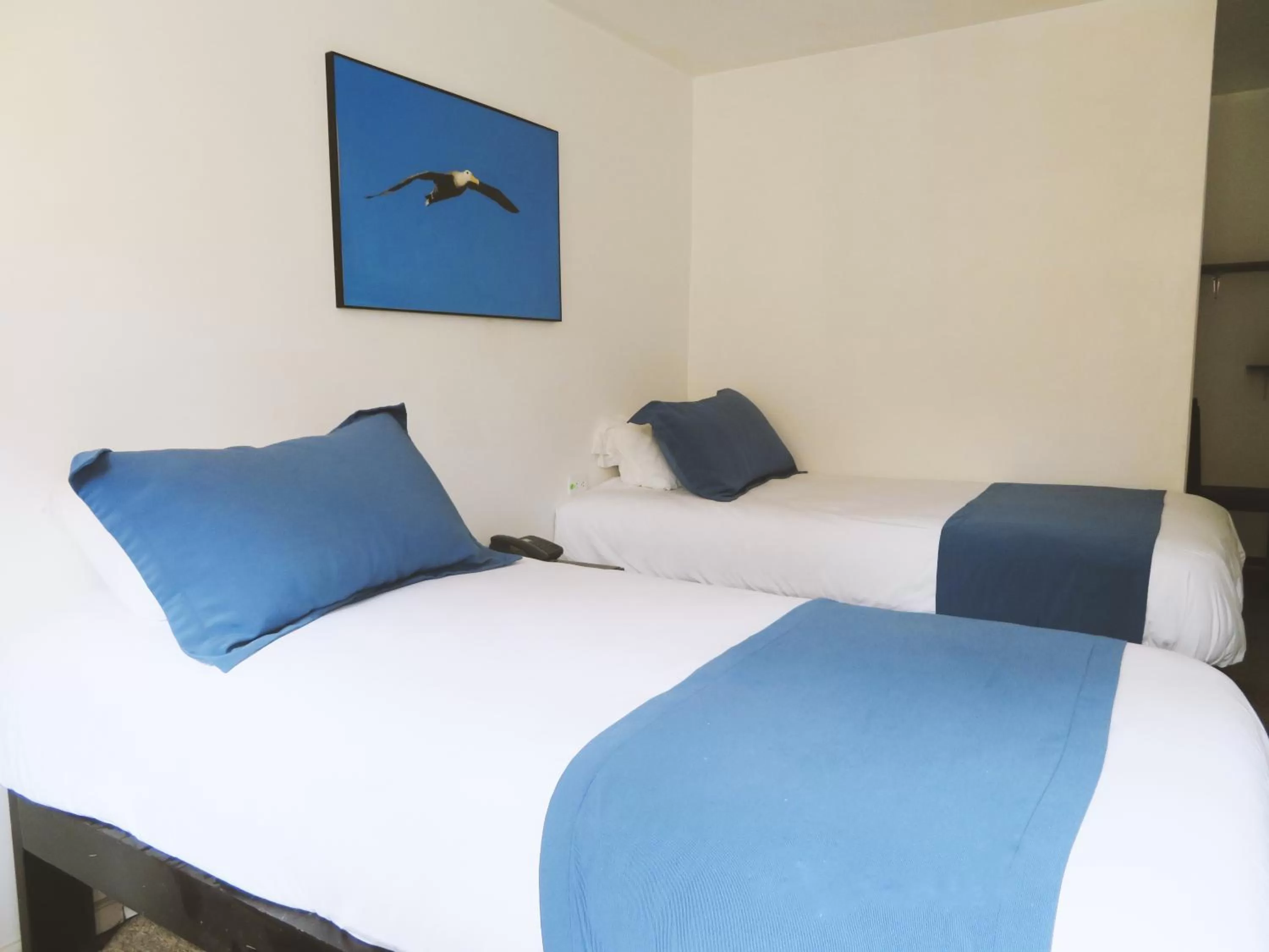 Bed in Bird Garden Guest House