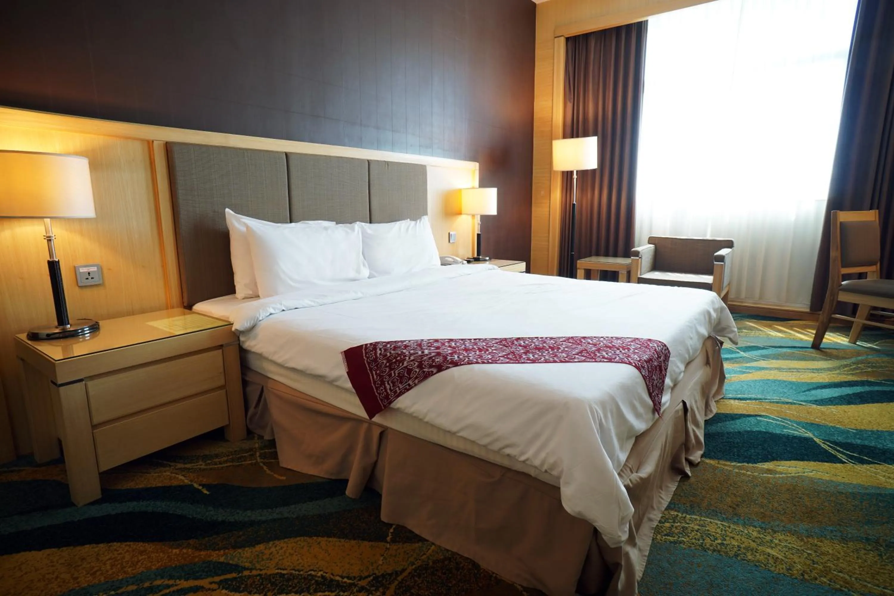 Bed in Imperial Palace Hotel