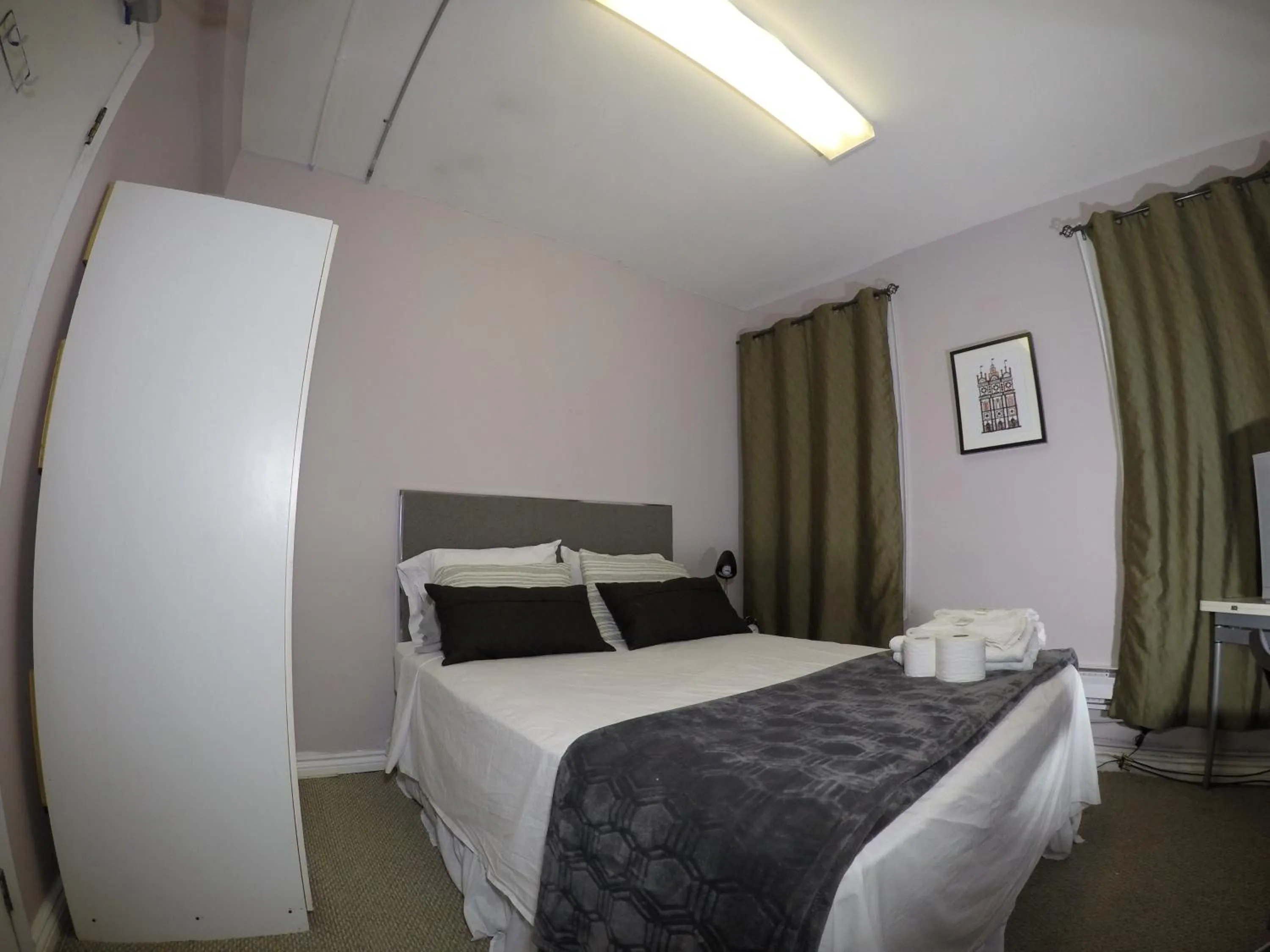 Photo of the whole room, Bed in Saint Lawrence Residences and Suites