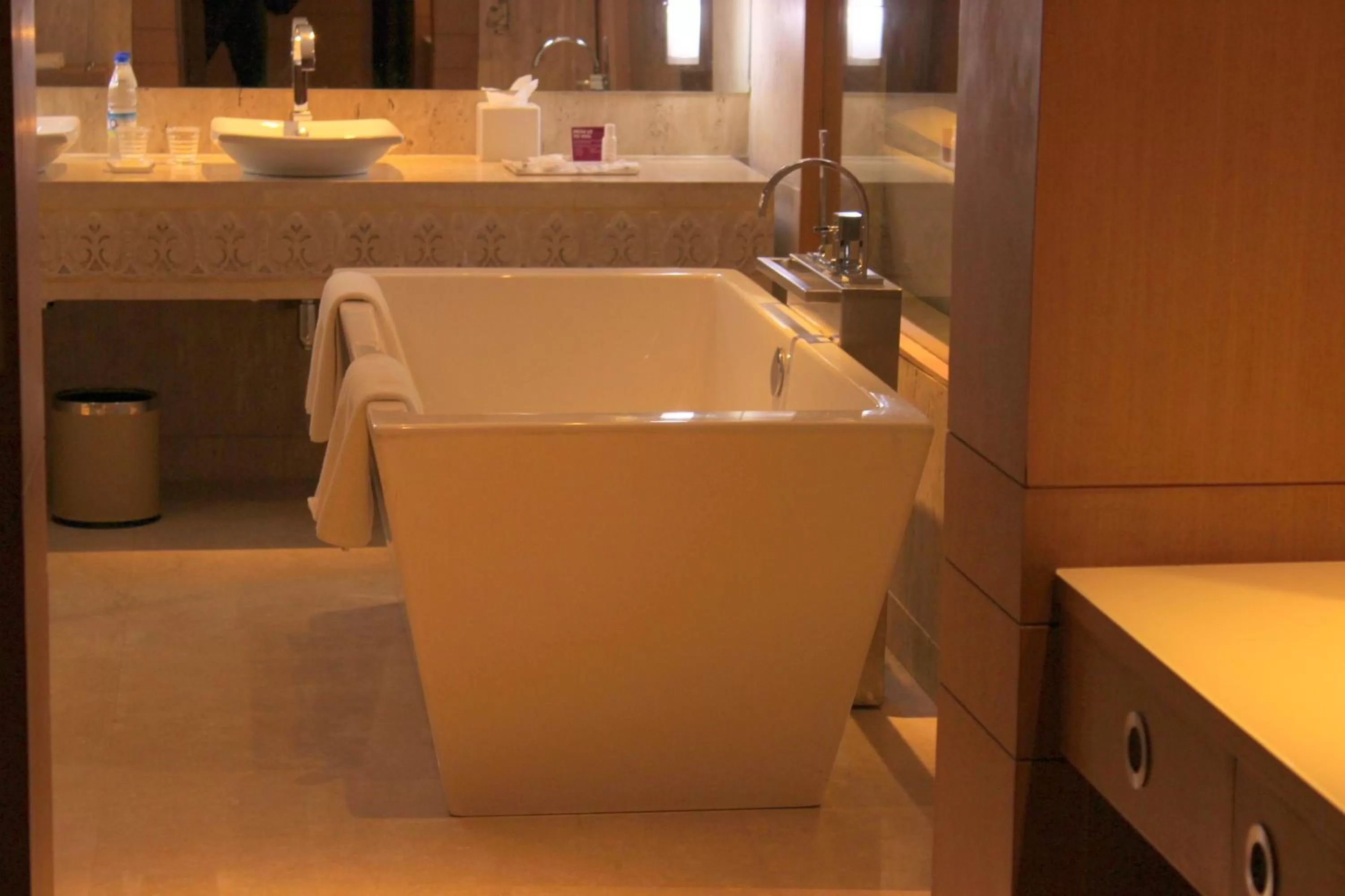 Bathroom in Crowne Plaza Greater Noida by IHG