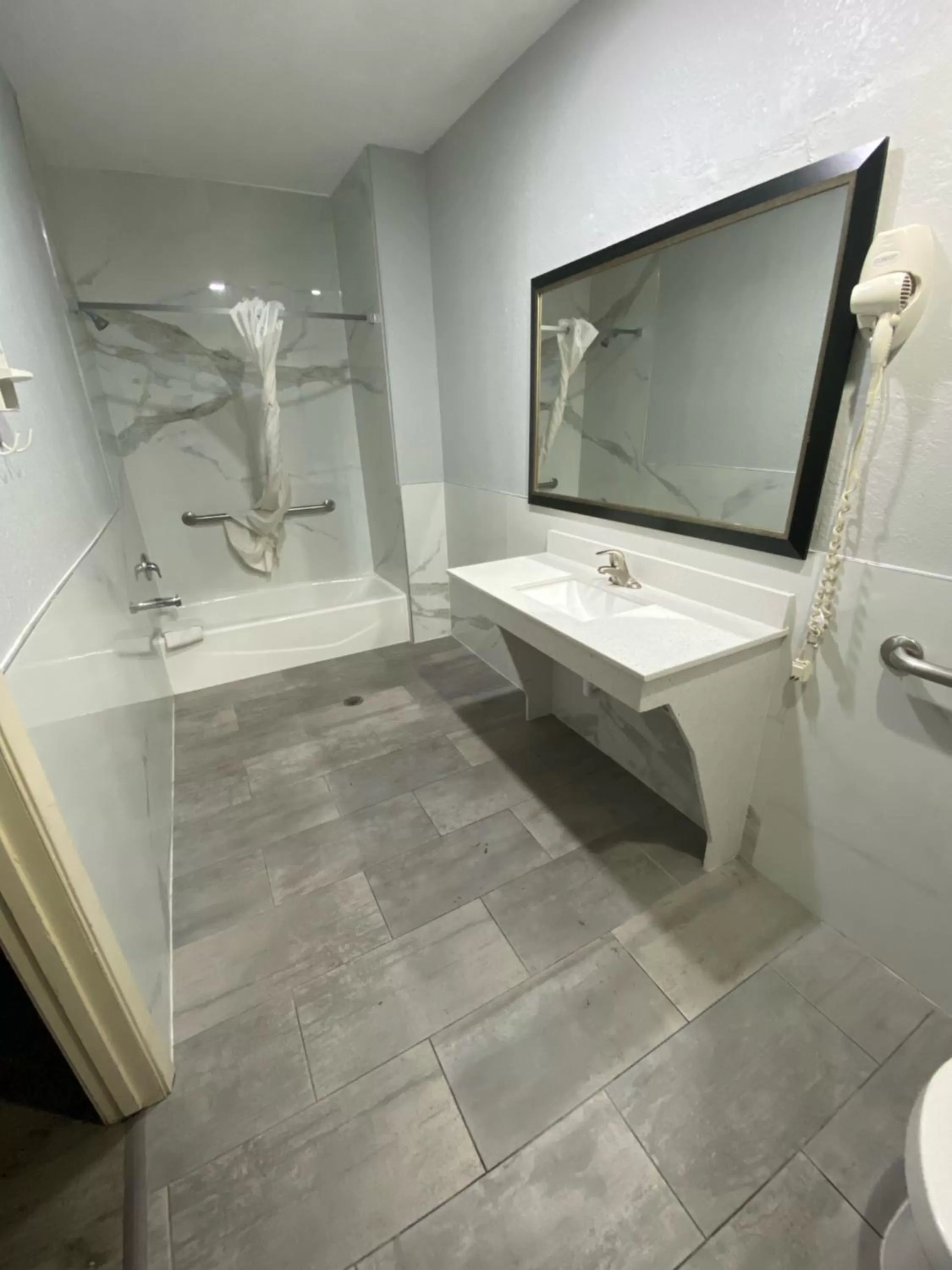 Bathroom in Super 8 by Wyndham Houston Hobby Airport South