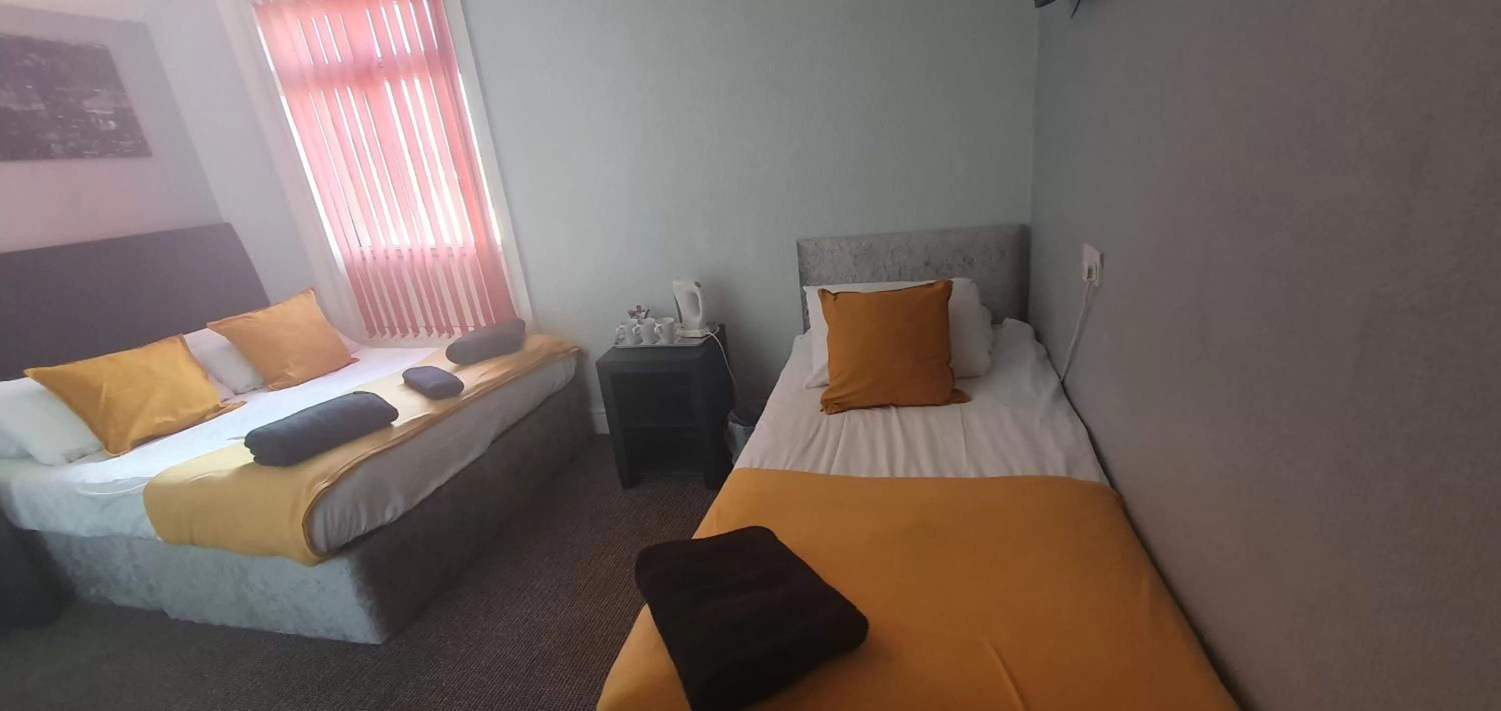 Bed in Palm Beach Hotel by the Sea