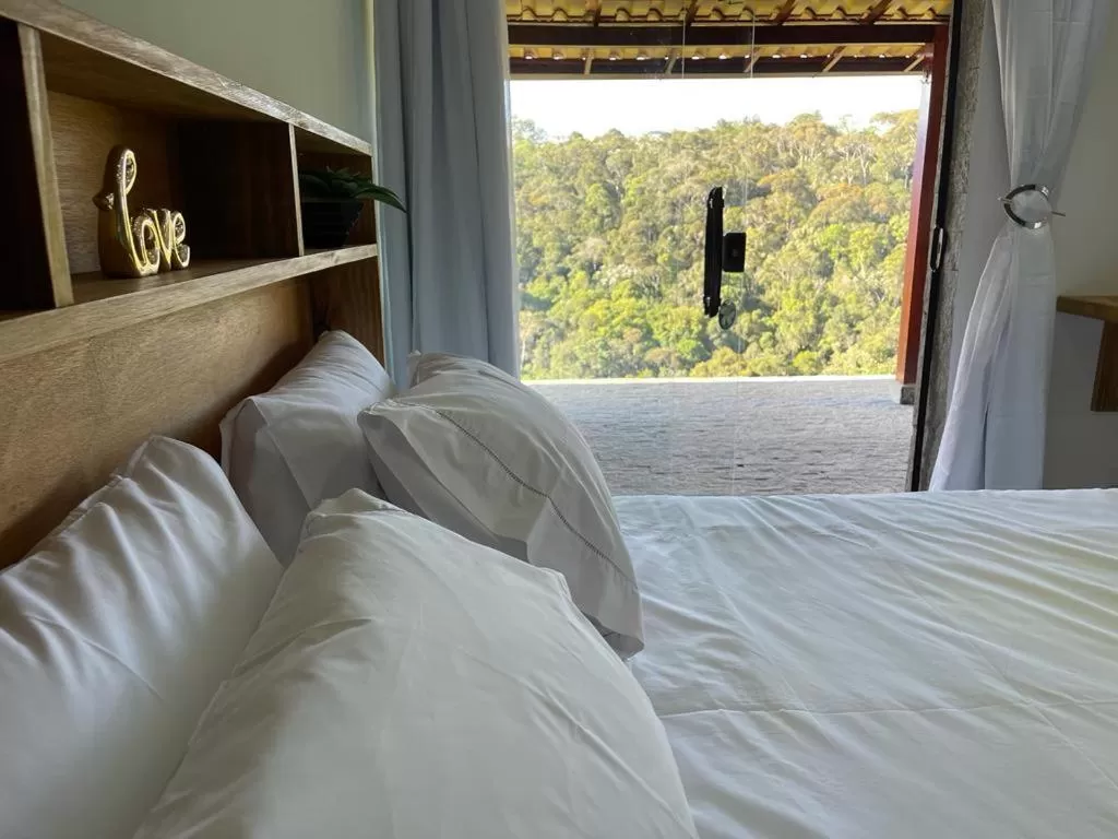 Bed in Pousada R.N.C. Nosso Paraíso