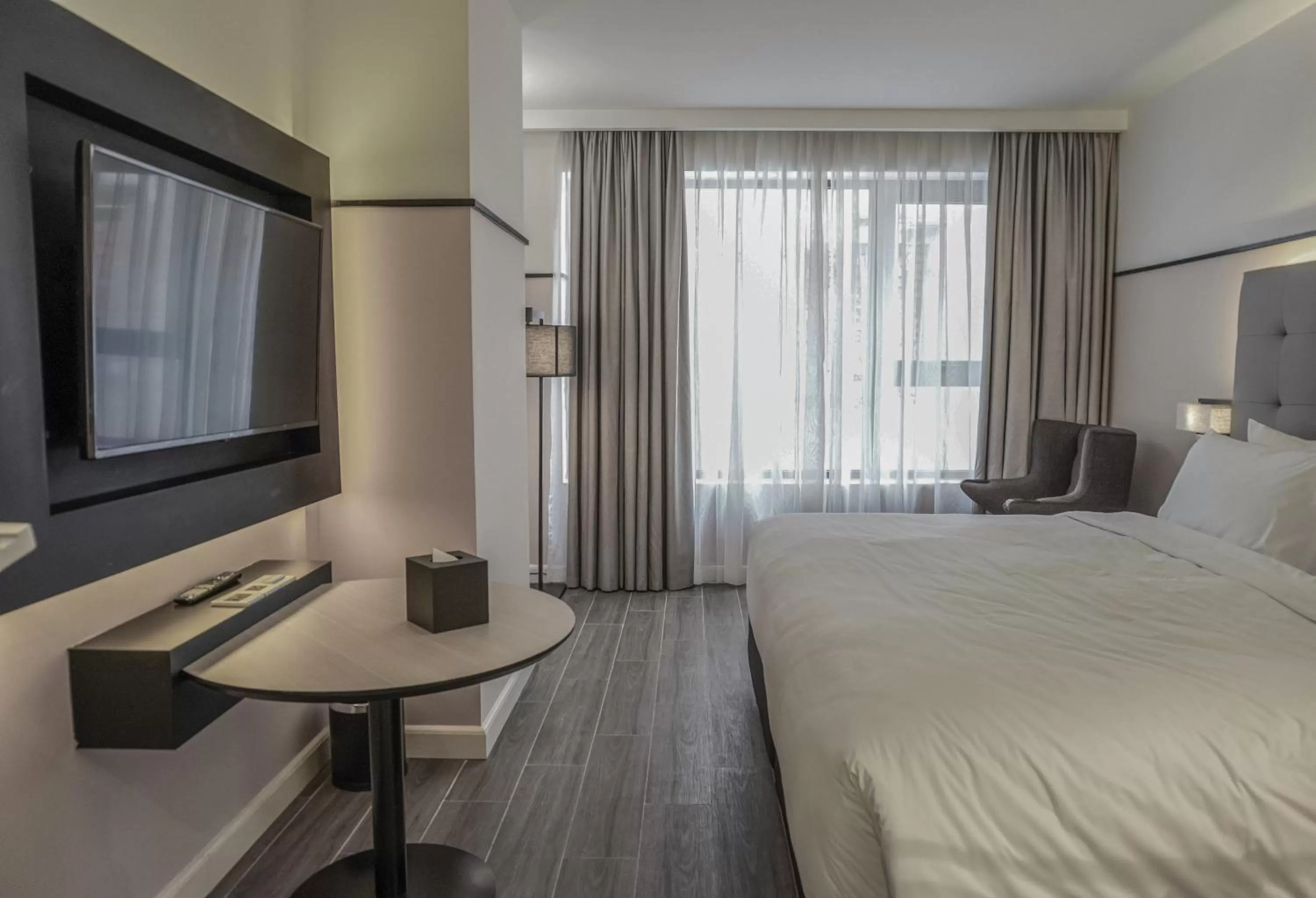 Photo of the whole room, Bed in M Village Hotel Tôn Thất Đạm