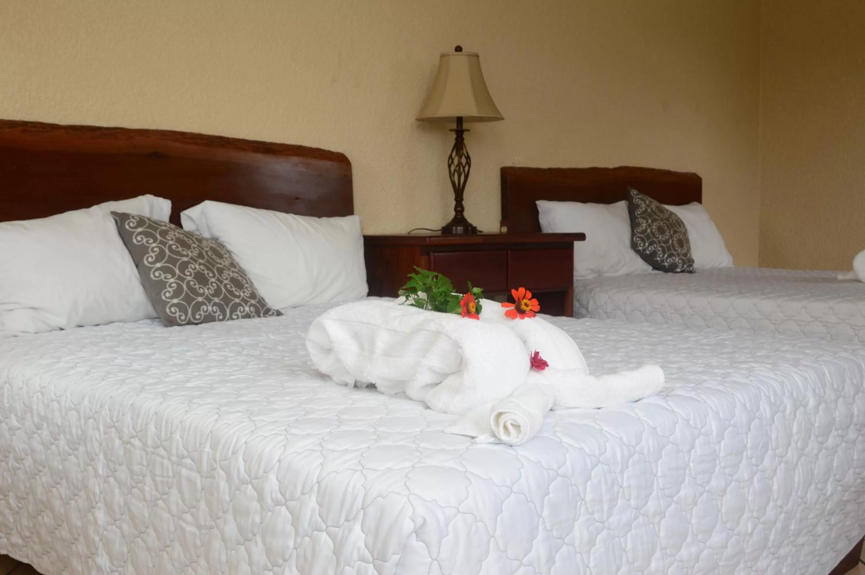 Bed in Lamanai Hotel & Marina