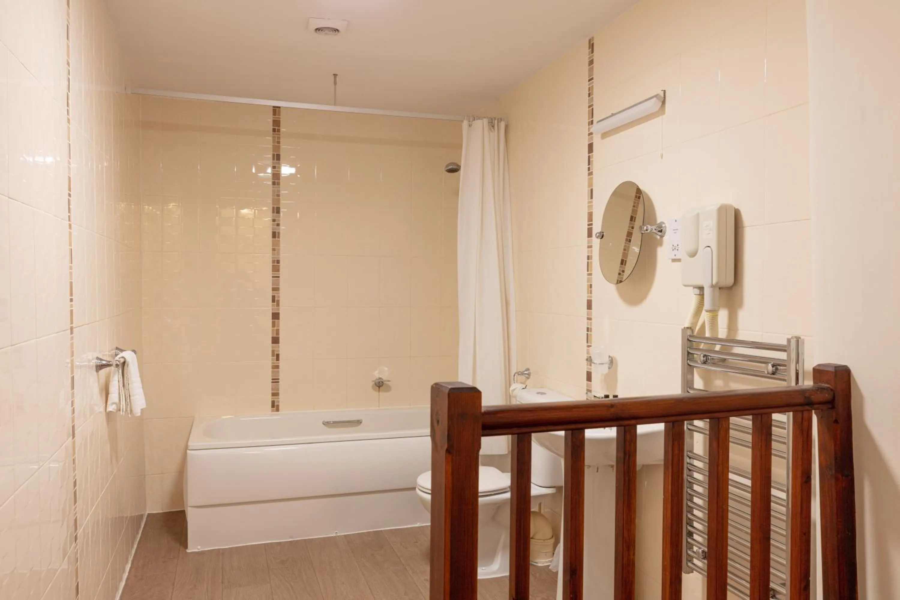 Bathroom in The New Inn by Roomsbooked