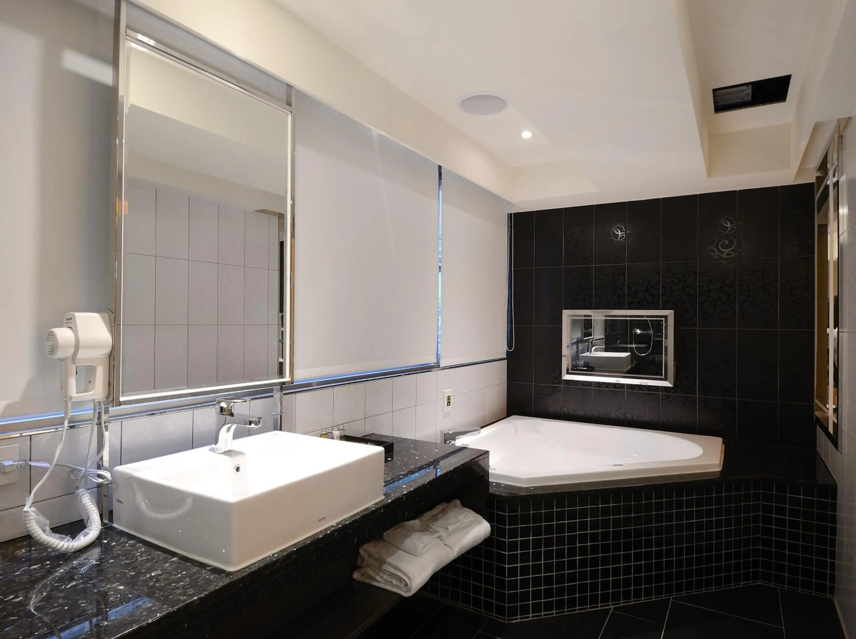 Bathroom in V-one Vogue Hotel